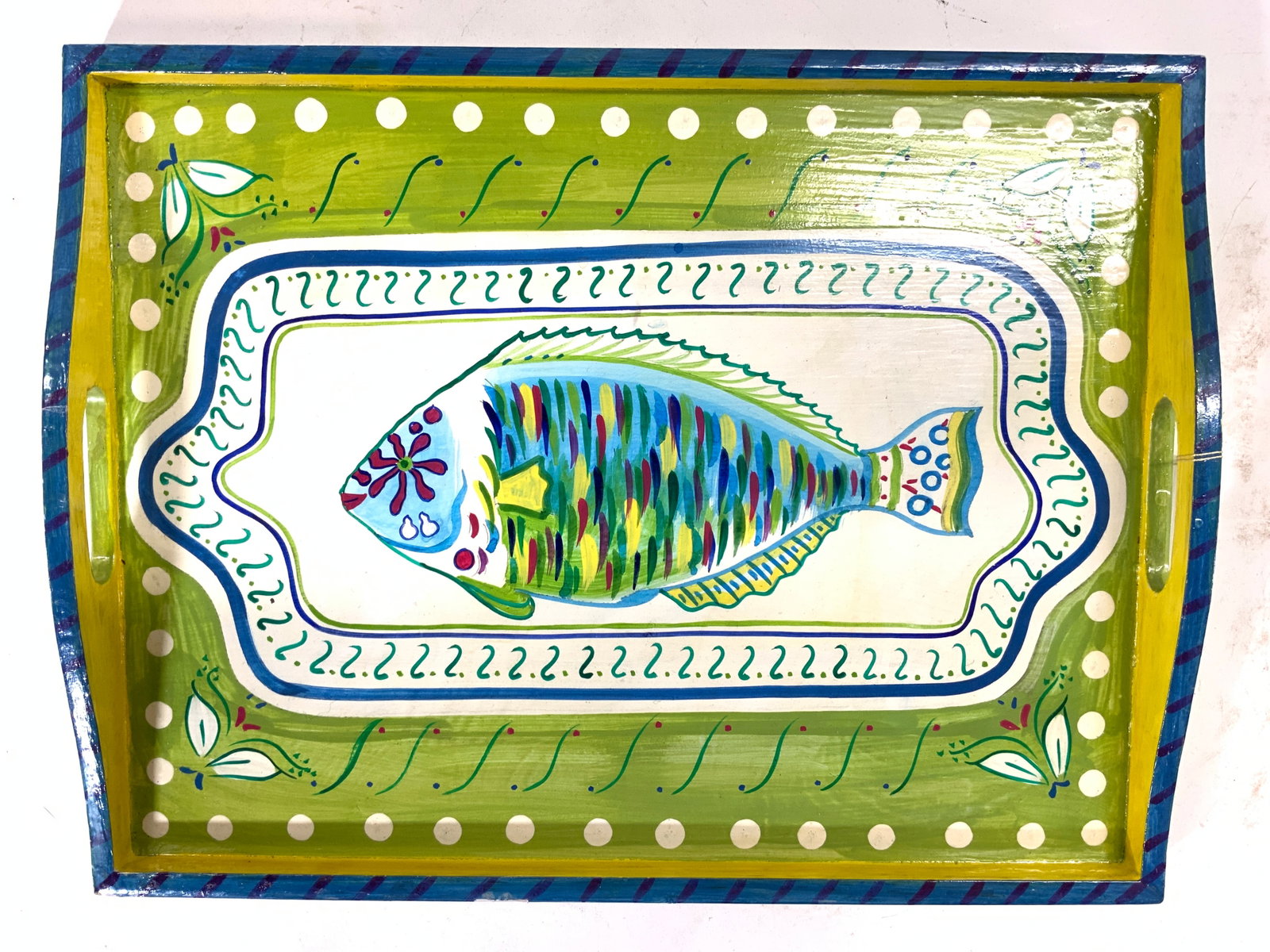 BARBARA FINSNESS DESIGNS Hand Painted Wooden Tray: Tag reads BARBARA FINSNESS DESIGNS. Piece is hand painted and wooden. Tray has fish , floral, leaf and geometric detail. Piece measures approx 17 inches long 13 inches deep 2 inches tall. Tray, wooden