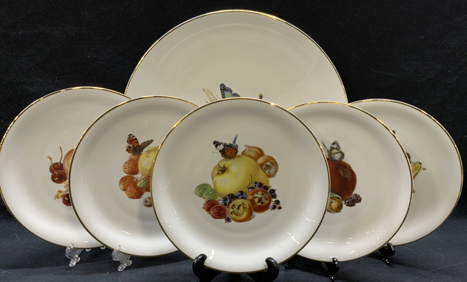 Set 6 Rosenthal Porcelain Fruit Plates, Germany: Set of 6 Rosenthal porcelain plates with fruit patterns. Trademarked to undersides. Made in Germany. Includes 1 platter/charger (12.75 inches diameter) and 5 luncheon plates (8 inches diameter each). 