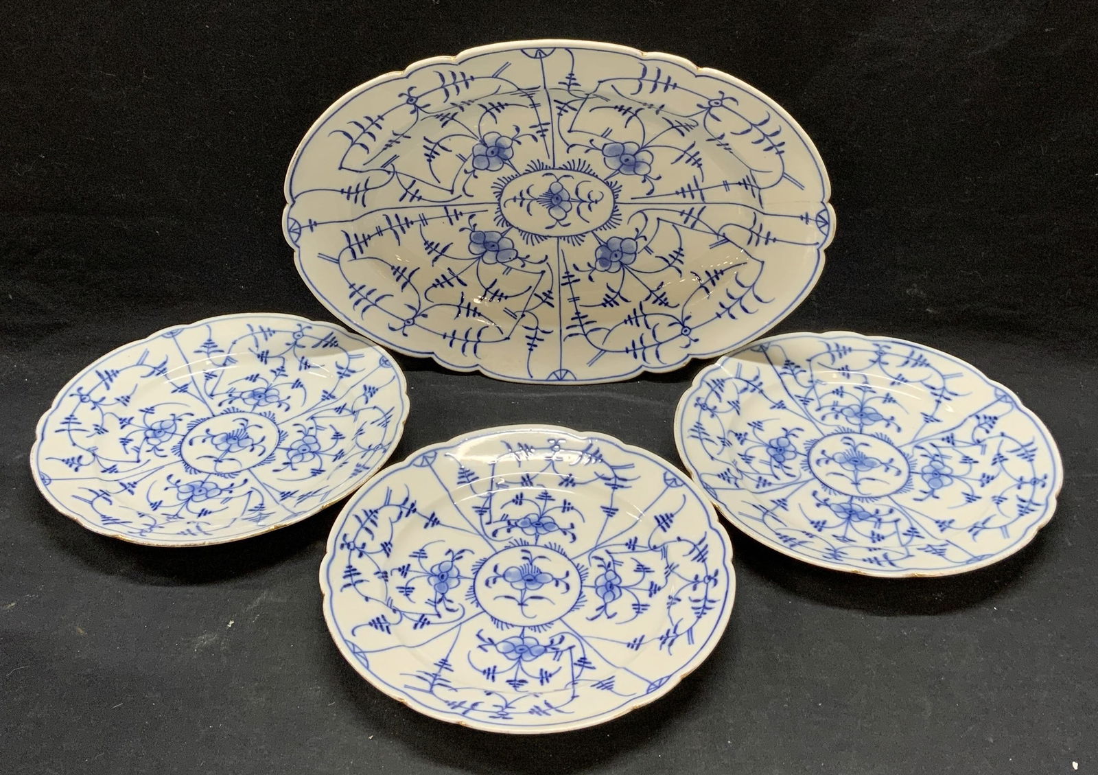 Set 4 T Germany Porcelain Blue Lace Tableware: Set of 4 vintage, possibly antique, T Germany porcelain tableware pieces in blue lace pattern. Trademarked to underside of plates. Includes 1 platter (14 x 10 inches) and 3 dinner plates (9 inches dia