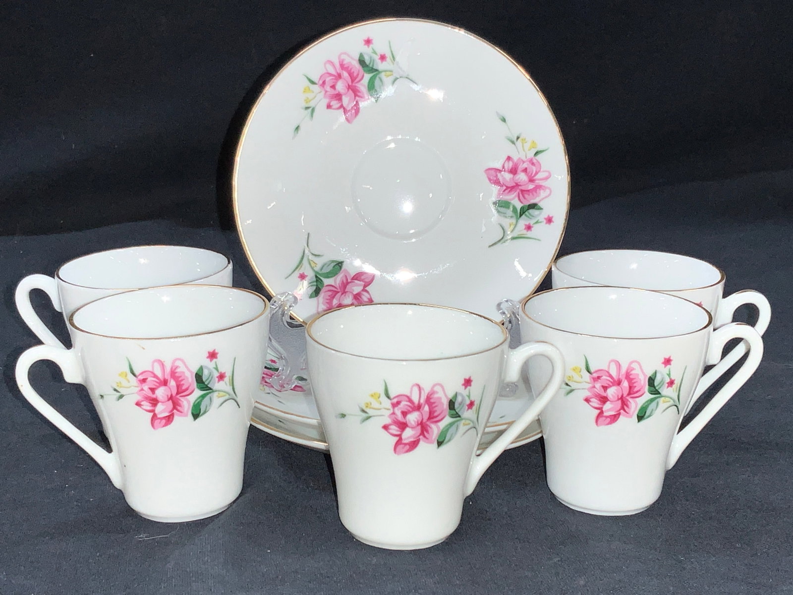 Set 8 Porcelain Floral Demitasse & Saucers: Set of 8 porcelain demitasse tea set. 3 saucers, at 4 inch diameter and 5 demitasses with gilt rims. All marked on underside with hallmark with Chinese characters, Approximately 2.5 inches tall. Minor