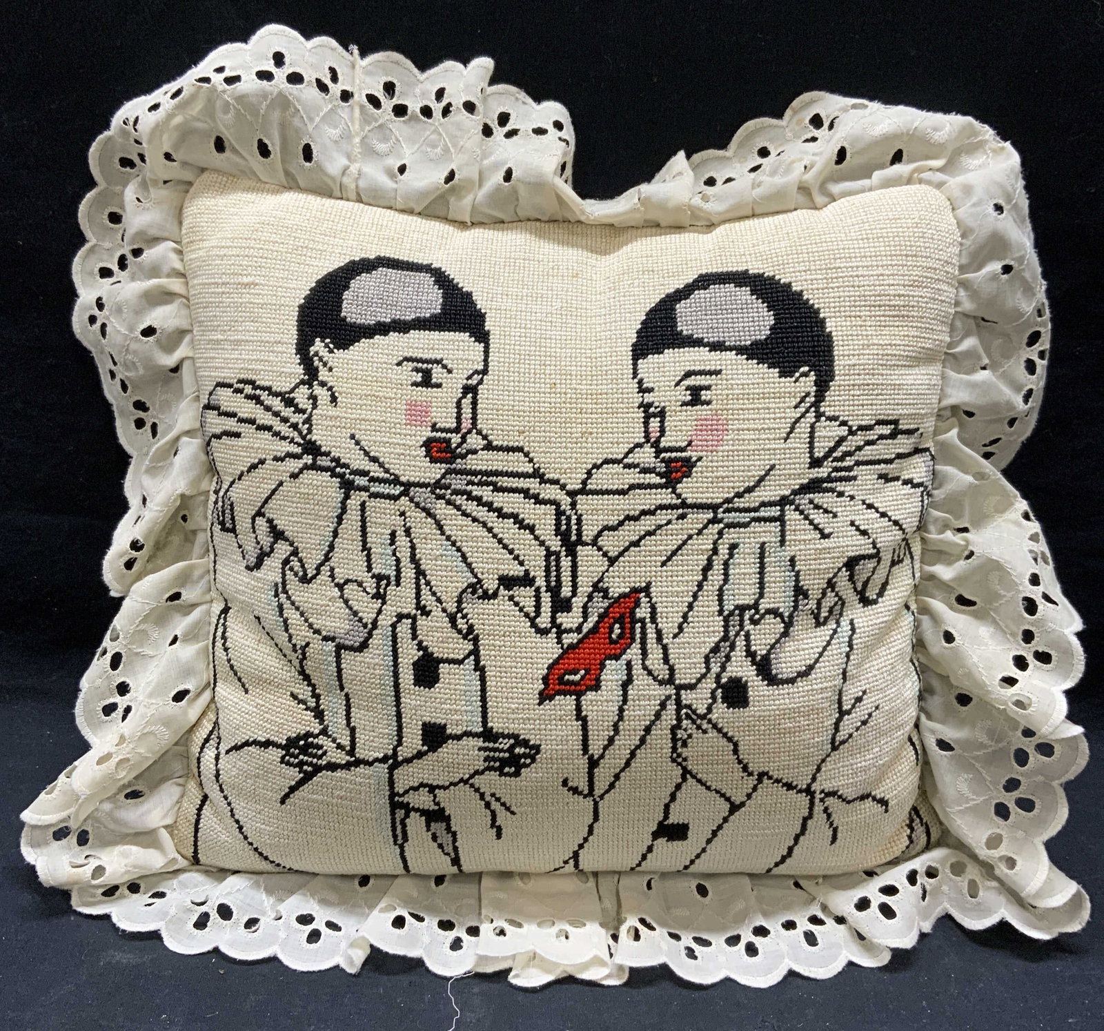Pierrot Clown Needlepoint Pillow: Needlepoint pillow with Pierrot clown motif. Lace border and velvet to reverse. Some wear to material consistent with exposure. Measures approx. 13.5 x 13 inches. Needlepoint pillow, Pierrot pillow, c