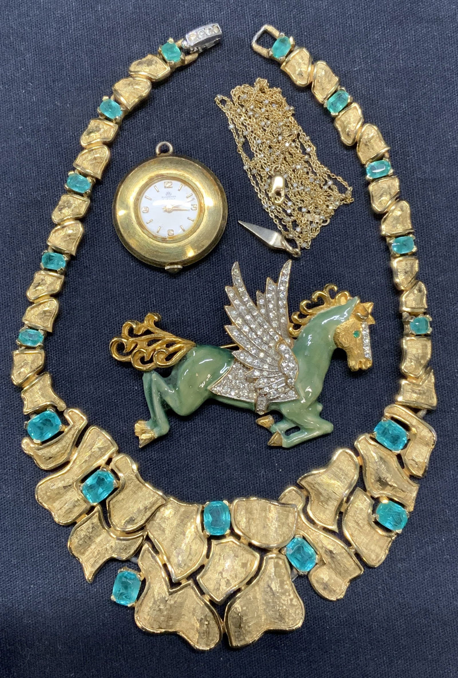 4 Kenneth Lane Brooch, 14KGF Necklace, More: Lot of 4 jewelry pieces. Signed KJL Kenneth Lane Pegasus brooch. Gold tone, crystal and enamel decorated. Signed to underside. Measures approx. 1 7/8 x 2.5 inches. Bucherer gold tone enameled watch pe
