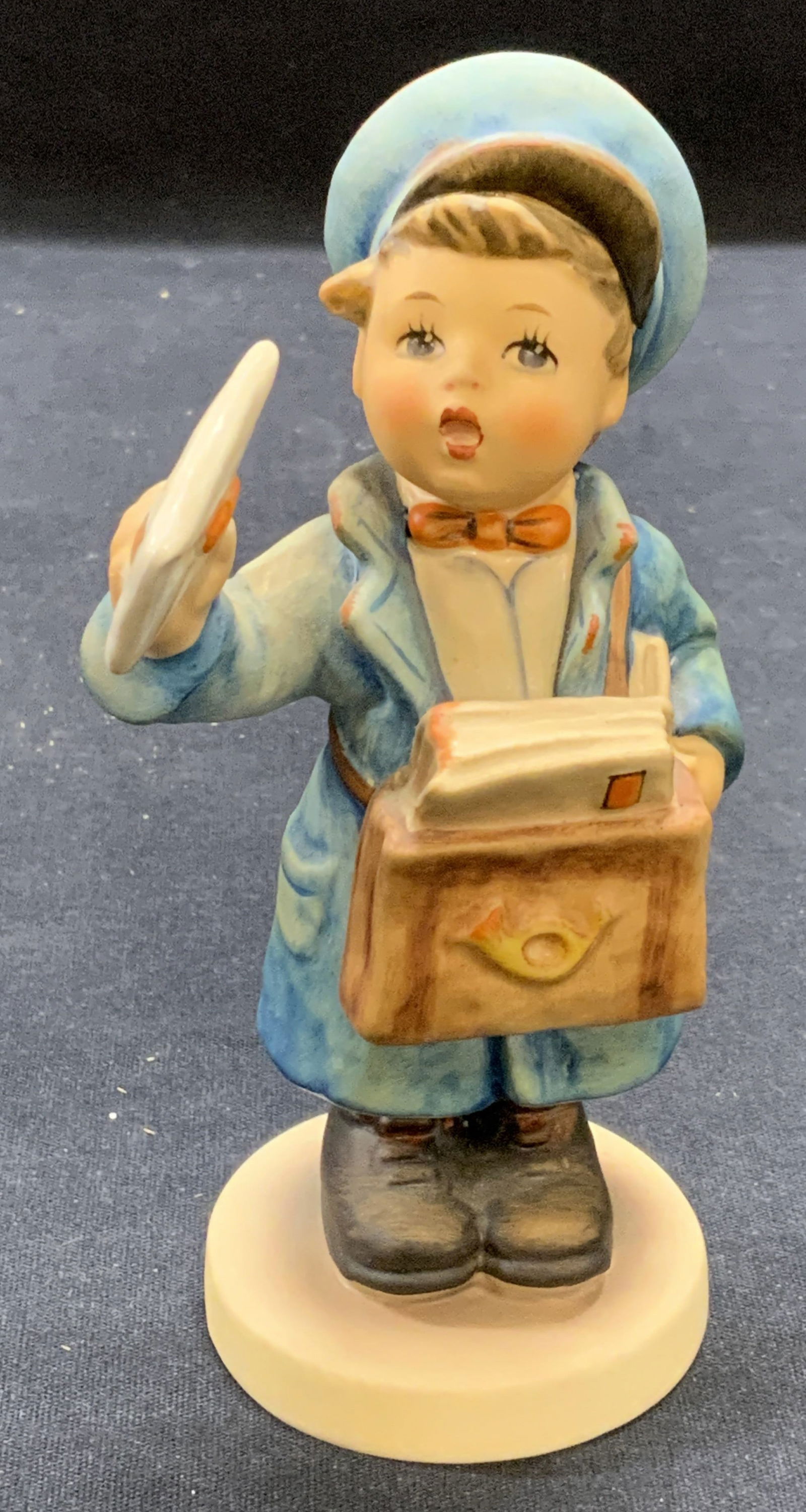 Vintage GOEBEL Porcelain Hummel Figurine: Vintage GOEBEL M J Hummel Figurine. Mail carrier. Trademarked to underside. Made in Germany, some surface wear consistent with exposure. Measures approx. 2.5 x 5.25 inches. GOEBEL, GOEBEL Hummel figur