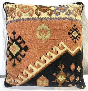 KAZAK Style Upholstered Throw Pillow: Pillow is upholstered with KAZAK rug style wool on one side. Piece has multi toned geometric detail. Backside is dark chocolate black toned. Edges of pillow have welting measures approx 16 inch wide 1