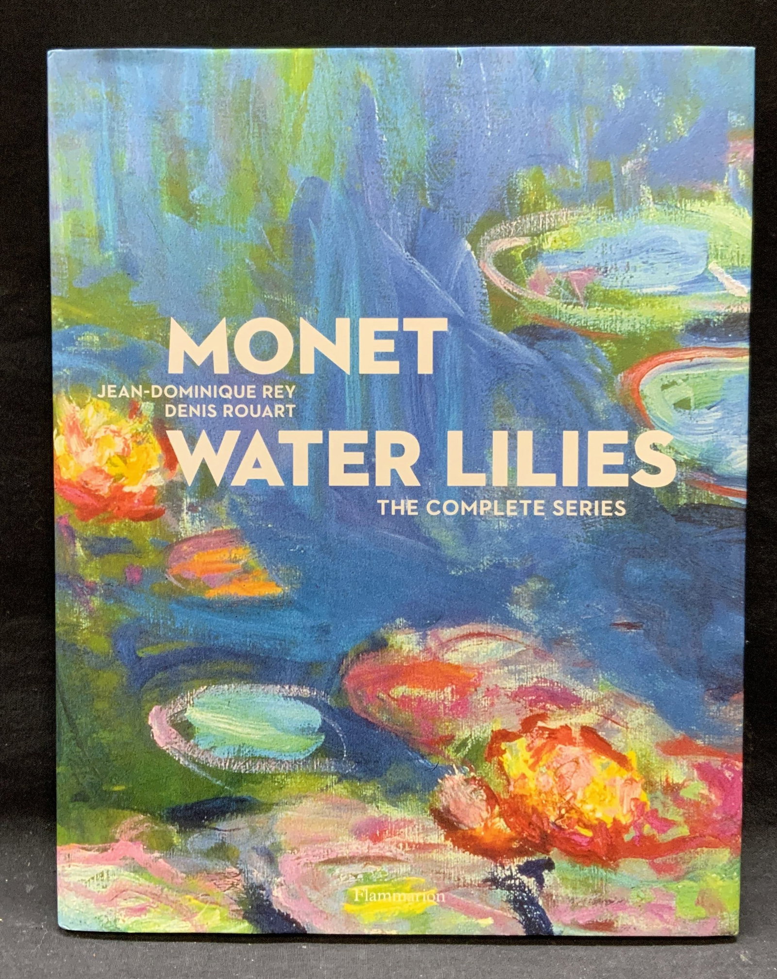 Monet Water Lillies Book: Hardcover copy of Monet WatermLillie The Complete Series by Jean Dominique Rey and Denis Rouart. Published by Flammarion, 2008. Measures approx. 12.5 x 9.75 inches. Some general shelf wear consistent 