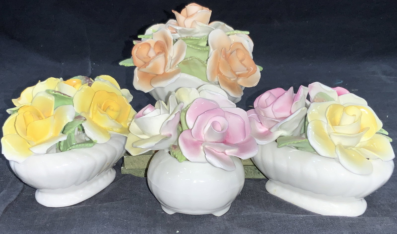 Set 4 Royal Stamford Fine China Bouquets Figurals: Lot of 4 near pair Royal Stratford fine bone china flower bouquet figurines in yellow, punk orange and variety one. Sizes vary, larger approx. 3.75 inches diameter and 4.25 inches tall. Trademarked to