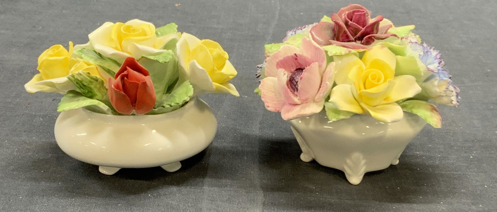 Lot2 Royal DOULTON Flower Bouquet Figurals England: Lot of 2 Royal DOULTON bone china flower bouquet figurines in pink, red, and yellow. Trademarked to underside. Made in England. Sizes vary slightly. Larger is approx. 3.5 inches wide and 2.75 inches t