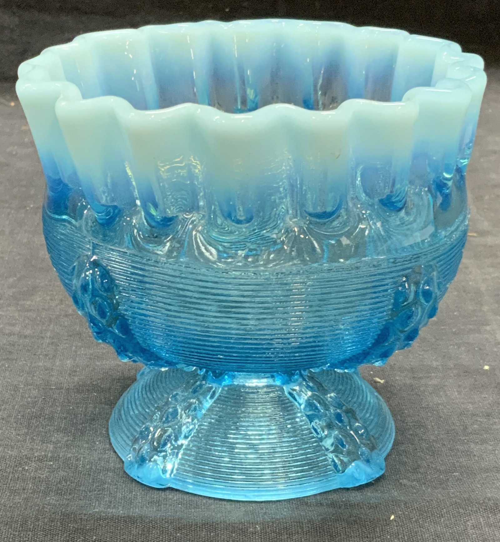 Vintage Blue Art Glass Handkerchief Bowl: Vintage blue art glass bowl with basket weave motif and handkerchief rim. Measures approx. 4.5 inches diameter and 4 inches tall. Some surface wear consistent with exposure. Art glass, art glass bowl,