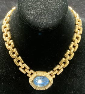 CINER Gold Tone Blue Crystal Choker Necklace: Vintage CINER gold tone chunky chain necklace with colorless crystal accents and blue crystal decoration. Signed to underside. Chain drop length approx. 7 inches. Blue crystal measures approx. .75 x 1