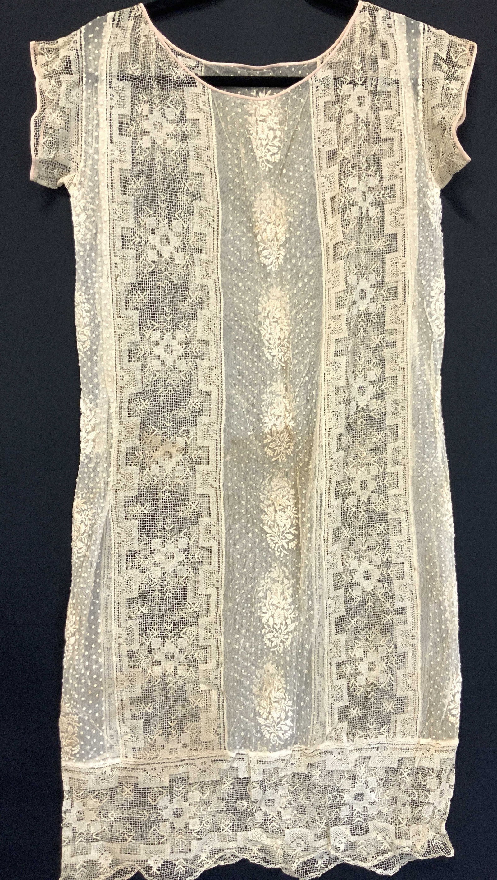 Antique Hand Stitched Lace Slip Gown: Antique, possibly vintage under gown slip, possibly hand crafted of various patterned trims. Sheer and see through throughout. Chest measures 18 inches across and width of skirt is approximately 19 in