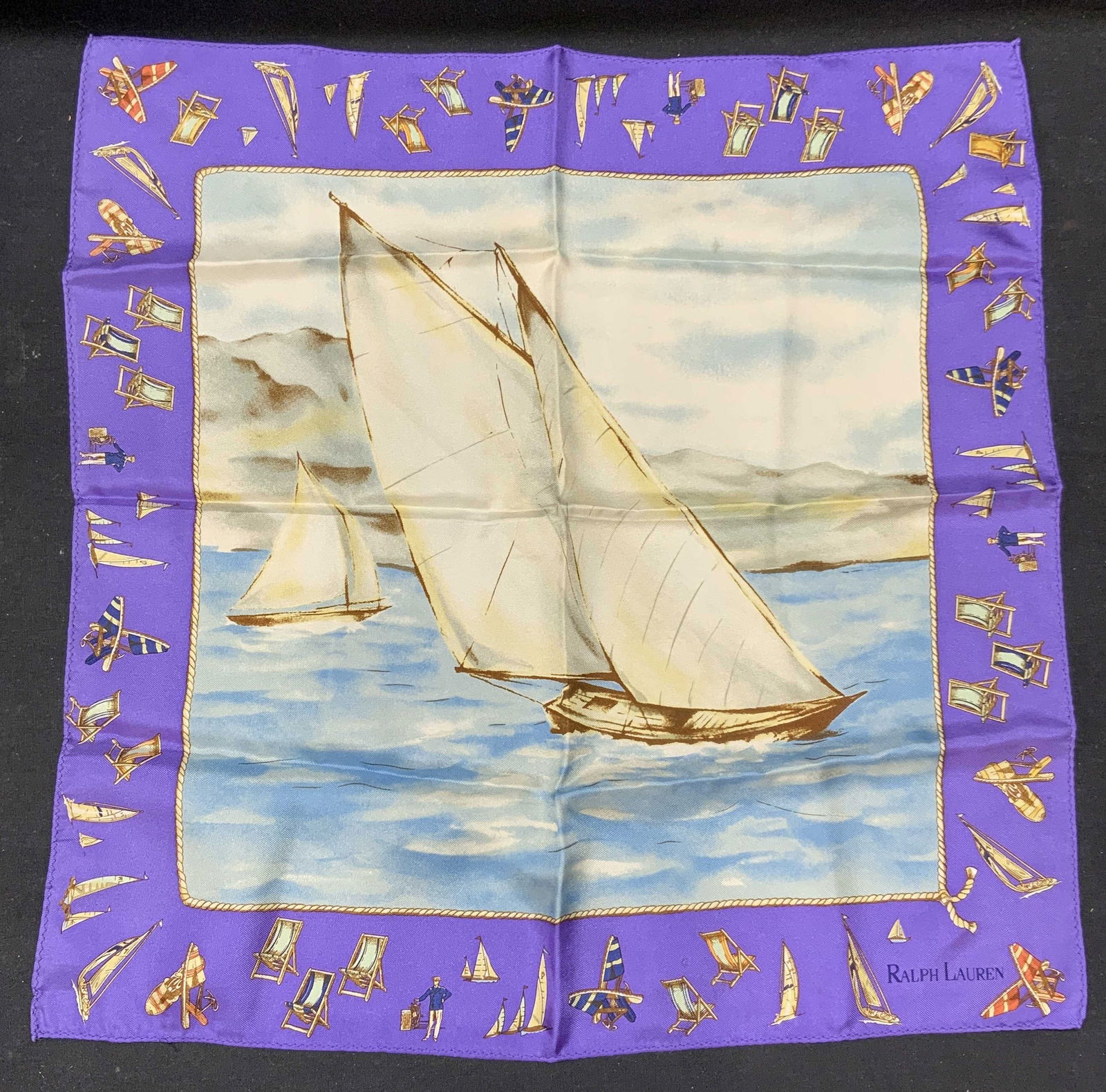 Ralph Lauren Silk Sailboat Handkerchief: Ralph Lauren silk handkerchief with sailboat motif. Designer label to lower right. Some wear to material consistent with exposure. Made in Japan. Measures approx. 17 x 17 inches. Ralph Lauren, Ralph L