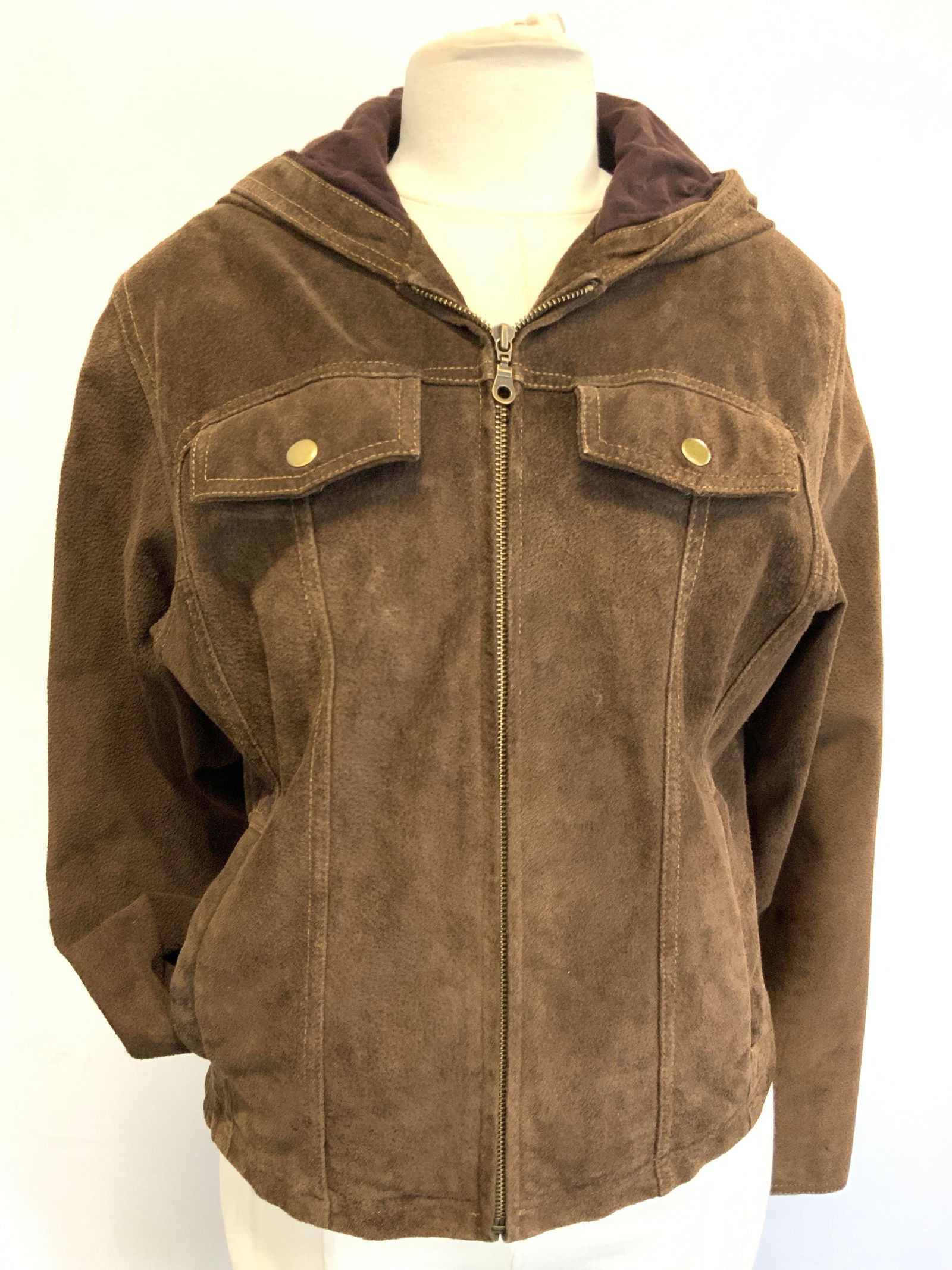 Maxima Size M Leather & Cotton Jacket: Marked Maxima, 100% Leather 100% Cotton, 100% Nylon Lining Chestnut brow jacket with hood. Moderate wearing and discoloration to sleeves and hood. Chest is approx 19 inches wide and sleeves are approx