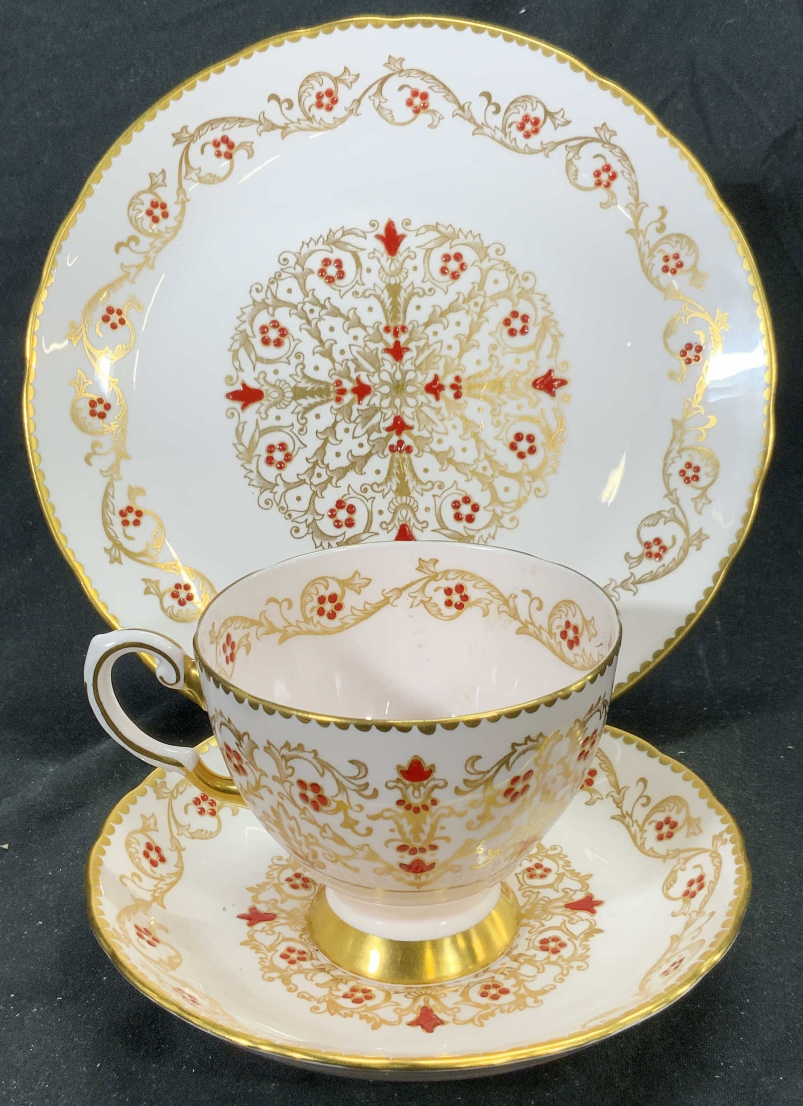 TUSCAN Set 3 Gilt Porcelain Teacup Saucer & Plate: Underside of each is marked TUSCAN FINE ENGLISH BONE CHINA Made in England. Each piece is pink with ornate gilt detail, red toned floral and leaf & gilt rims. Plate measures approx 8 inches diameter. 