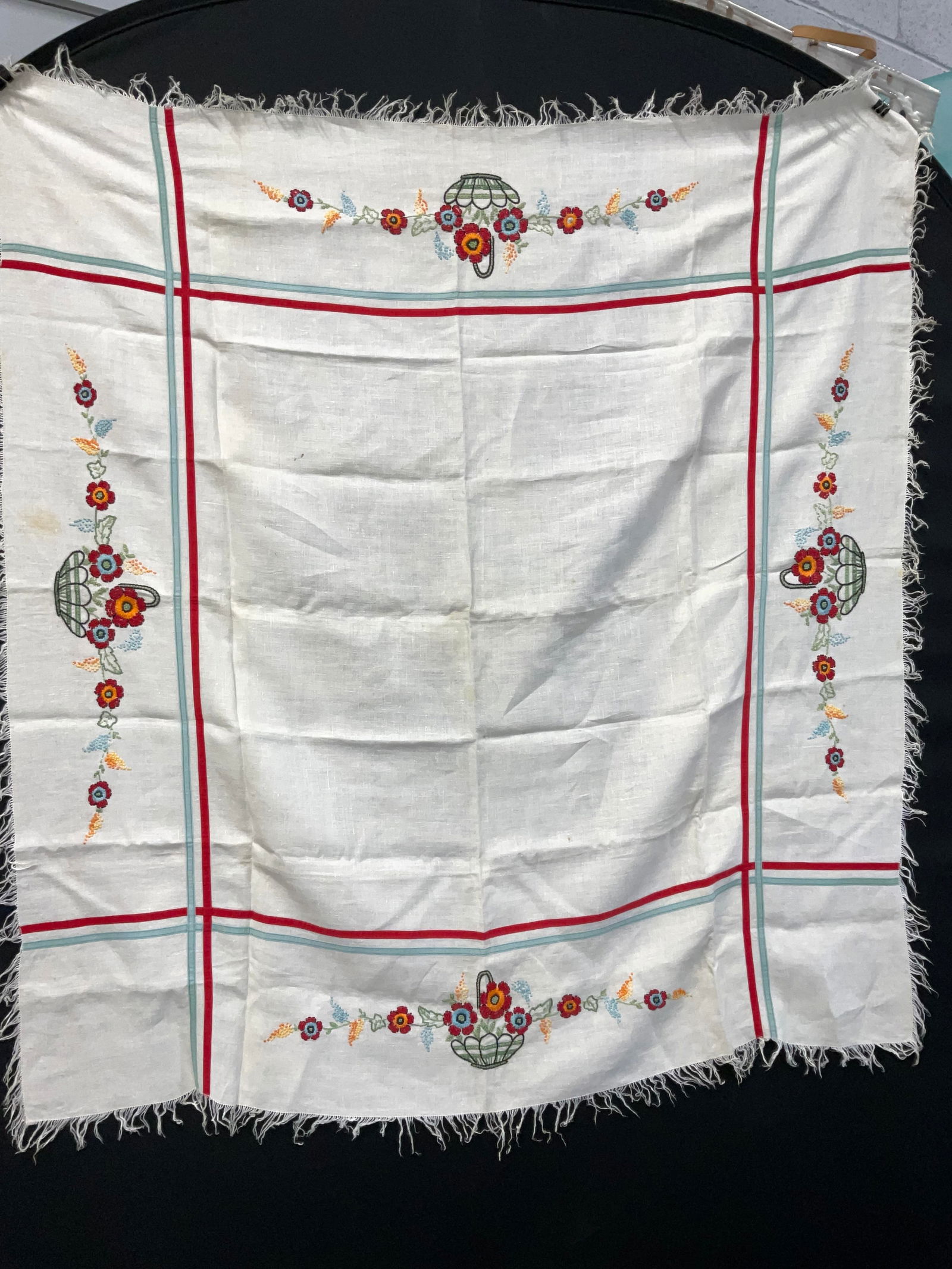 Floral Embroidered / Fringed Table Cloth: Floral Embroidered / Fringed Table Cloth. Possibly vintage. Some staining to surface (see photos). Measures approx 43.5 x 47 inches. No material tag or name label. Possibly linen. Cottage core, up cyc