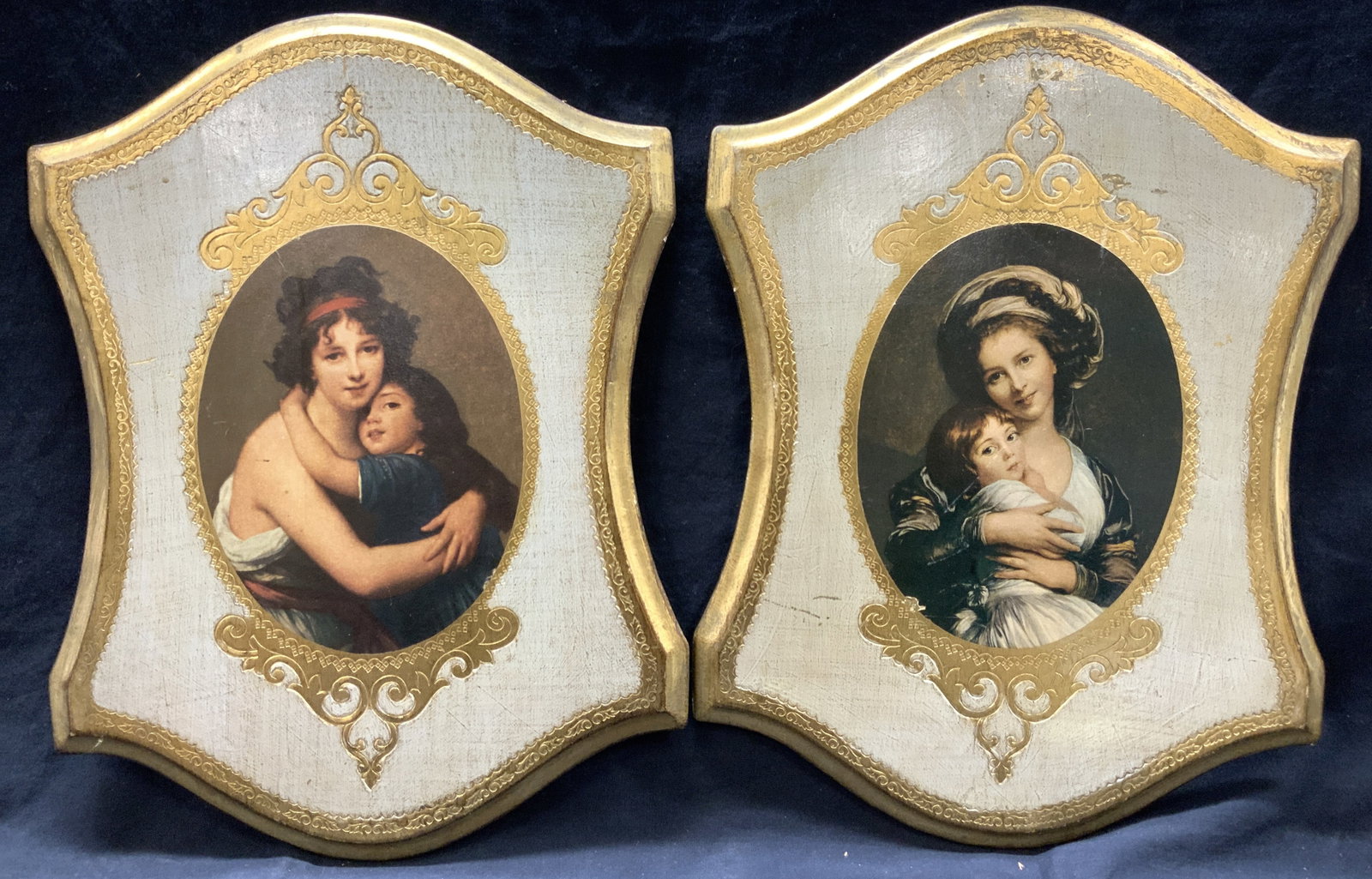 2 Gilt & Painted Mothers W Daughters Lithographs: 2 lithographs of mothers with daughters, 1 depicts Vigee Lebruns self Portrait of her and her Daughter and the other depicts another mother holding her daughter in her arms. Plaques are made of wood w
