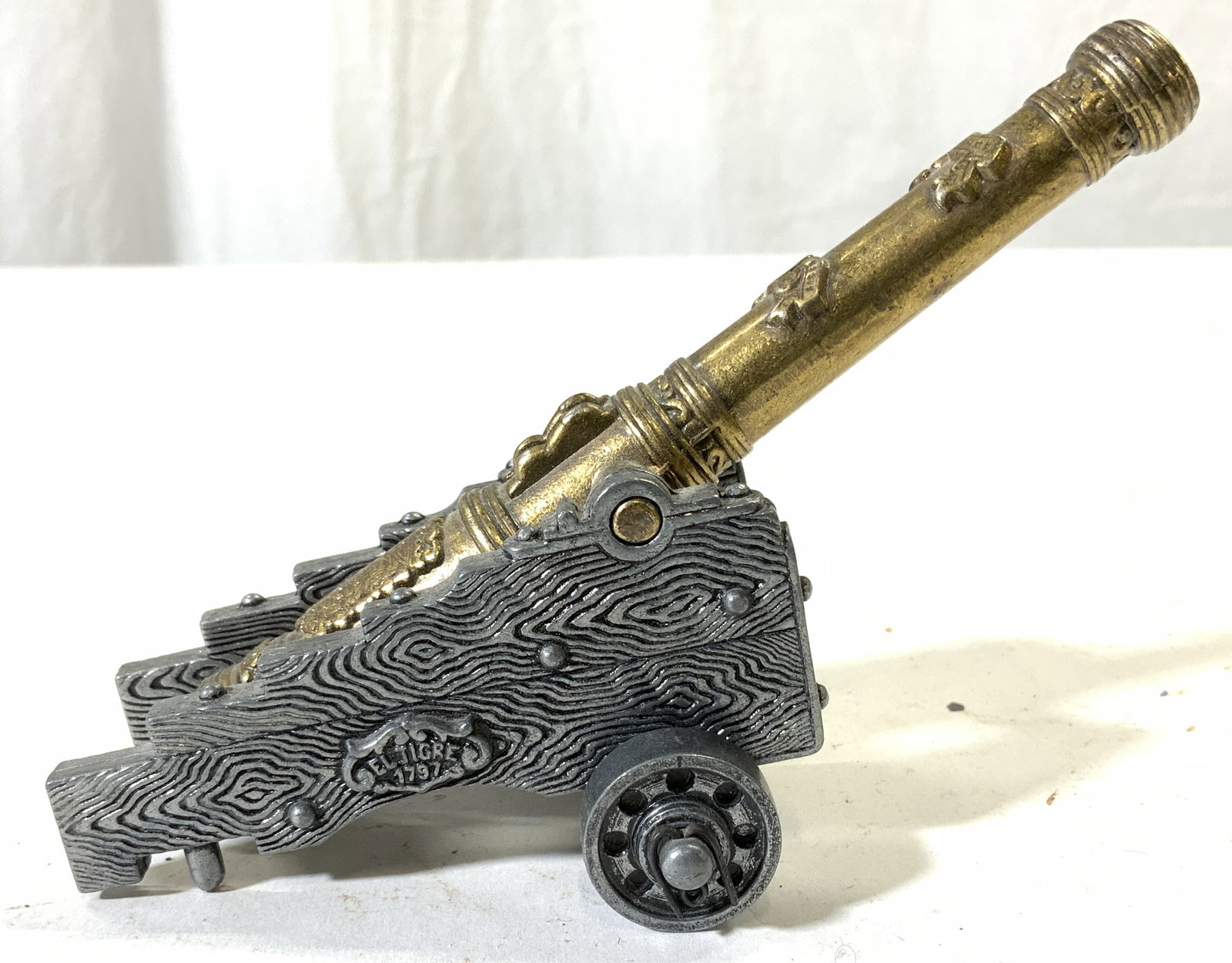 Vintage Pewter & Gilt Canon Figure W Wheels: Canon figure appears to be pewter. Piece has gilt barrel. Canon figure has wheels. Piece measures approximately 5.75 inches long 4 inches tall 2.75 inches wide. Canon, pewter canon, canon figure, vint