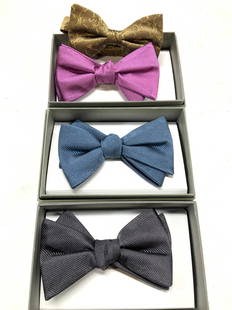 Jos. A Banks Silk Bow Ties, 4, NIB: 3 ribbed silk ties in charcoal, pink, and blue , all new in box. One size. Signed Jos A Banks.. 1 bronze jacquard silk bowline , new in package , adjustable length , 22.5 longest length. Bow tie measu