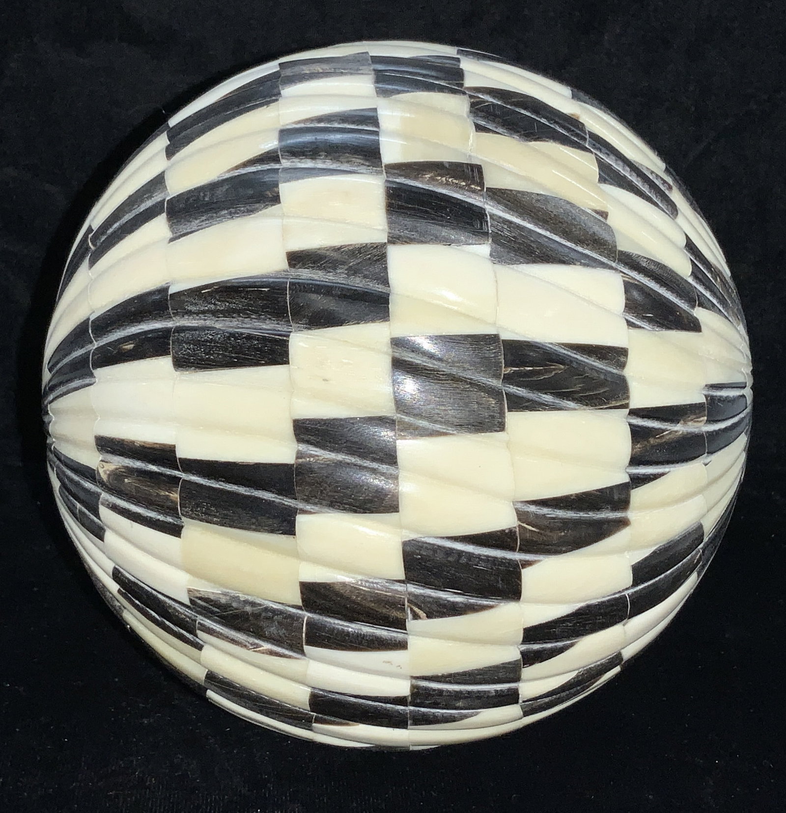 Hand Crafted Black and White Bone Orb: Hand Crafted decorative orb for bowl, basket, or table / console.Alternating check design with carved directional pattern. Measures 5.5 in. Decorative arts, Carved bone orb, bowl ornament, black and w