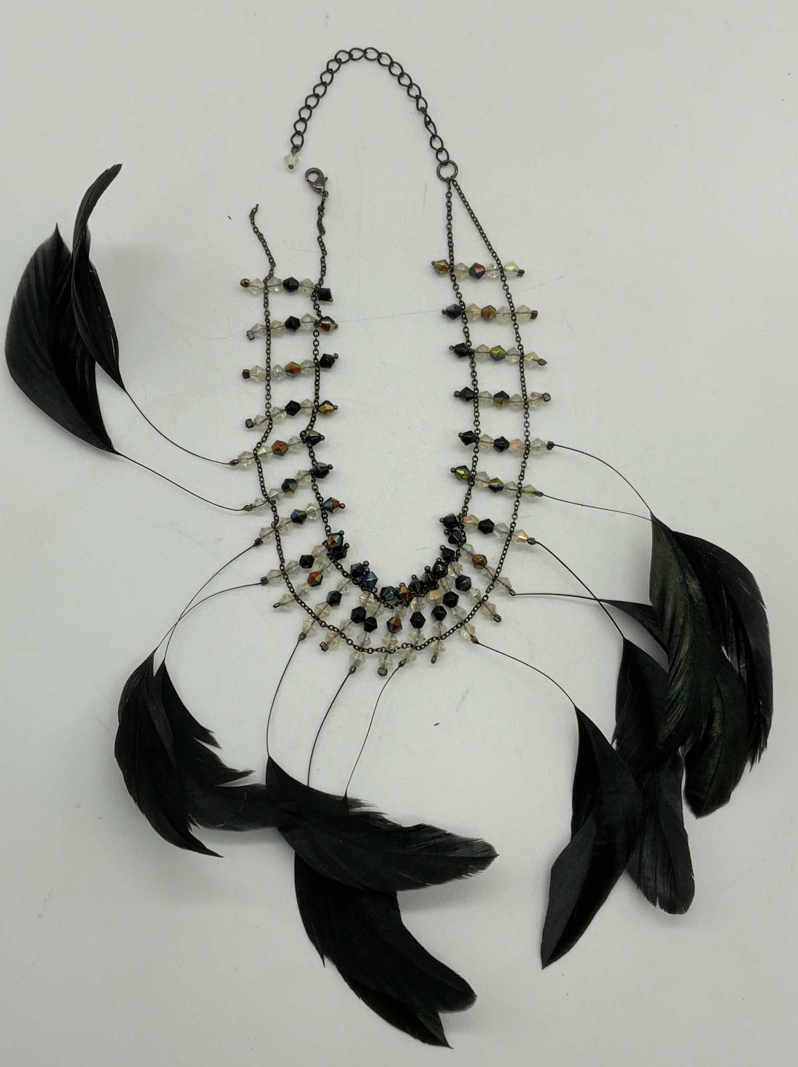 Vintage Black Feather Crystal Choker Necklace: Vintage black feather decorated crystal choker necklace. Chain needs repair on one end. Necklace measures approx. 14 inches long, drop length approx. 7 inches. Lot includes box. Estate jewelry, costum