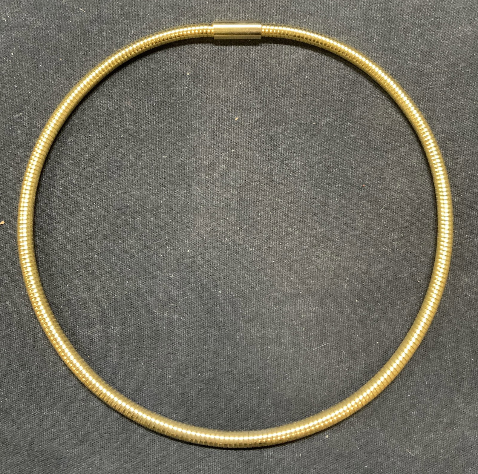Gold Tone snake Chain Choker Necklace: Gold tone snake chain choker necklace. Measures approx. 18 inches long, 5.5 inches diameter. Some surface wear consistent with exposure. Estate jewelry, costume jewelry, fashion jewelry, cocktail jewe