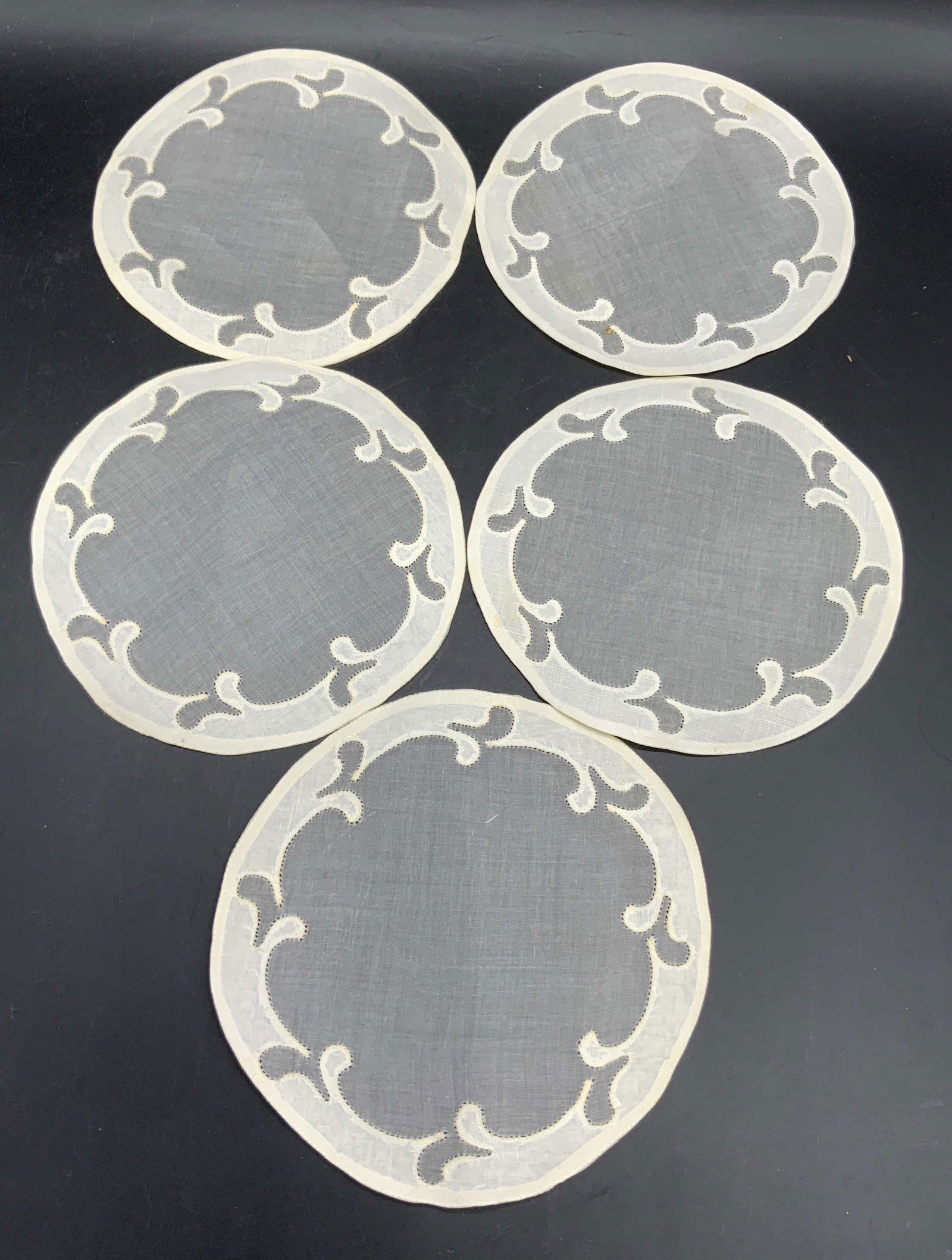 Set 5 Vintage Semi Sheer Circular Doilies: Five vintage semi sheer circular doilies. Off white hues. Measures approx. 6.25W x 6.25L in. Some discoloration and surface wear present. Vintage doilies, semi sheer doilies, table accessories, table