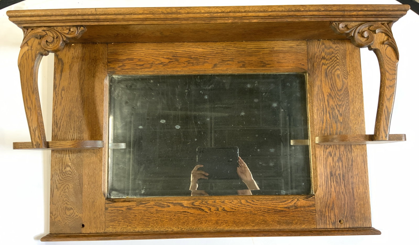 Vintage Carved Wooden Wall Mirror: Backside is marked 911 SB. Mirror is vintage and wooden. Piece has carved scroll filigree detail. Measures approx 25 inches tall 41.5 inches wide 11 inches deep. Wall mirror, wooden mirror, wood frame
