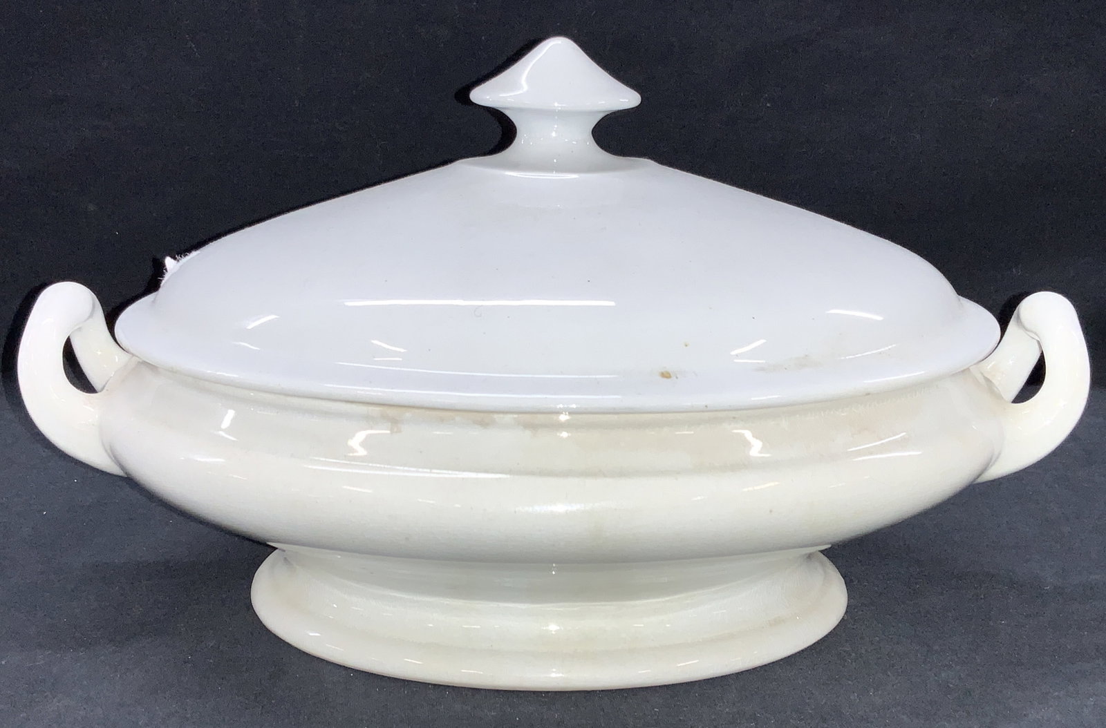 Ironstone Porcelain Tureen: Marked on underside Royal patent Ironstone, Turner Goddard D & C Double handled with lid. Approximately 8 inches tall and 13 inches wide. Evident wearing base of the and crazing to interior. Ironstone