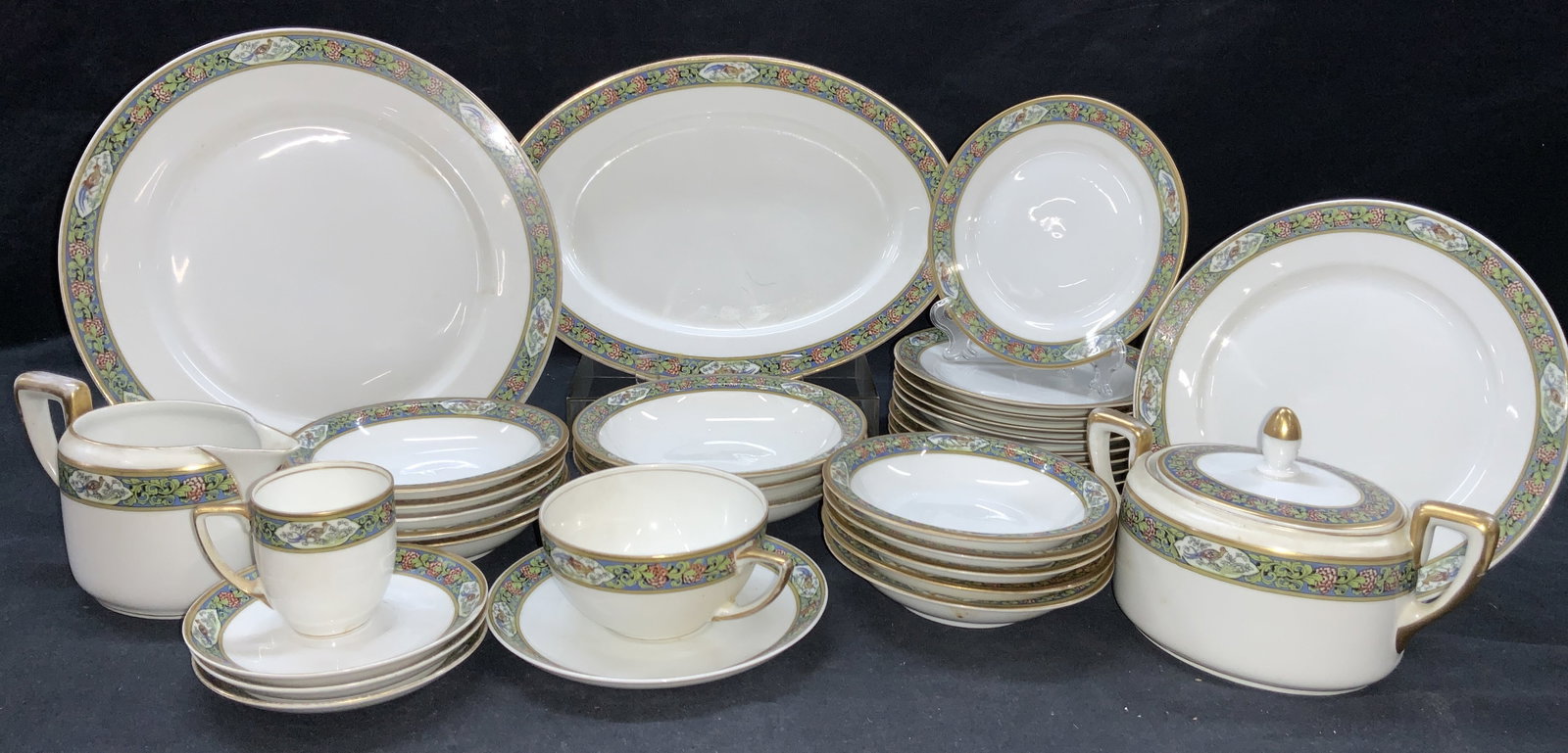 Set34 Rosenthal Isolde Porcelain Dishes: Set of 34 Rosenthal porcelain dishes with Isolde Pattern on edges. Consists of one platter at 11 inch diameter, 1 dinner dish at 10 inch diameter. 1 appetizers dish at 7.5 inch diameter. 10 inch diame