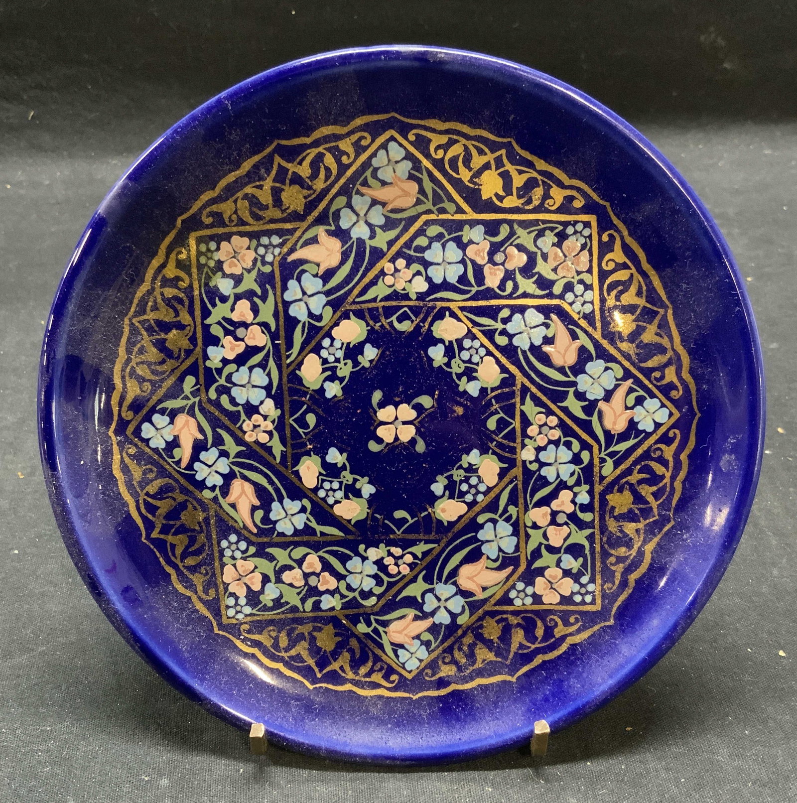 Handcrafted Gilt Porcelain Art Plate, Turkey: Handcrafted gilt porcelain art plate with floral motif. Made in Turkey. Measures approx. 6 5/8 inches diameter, some surface wear including loss to gilt and scratches observed. Art plate, display plat