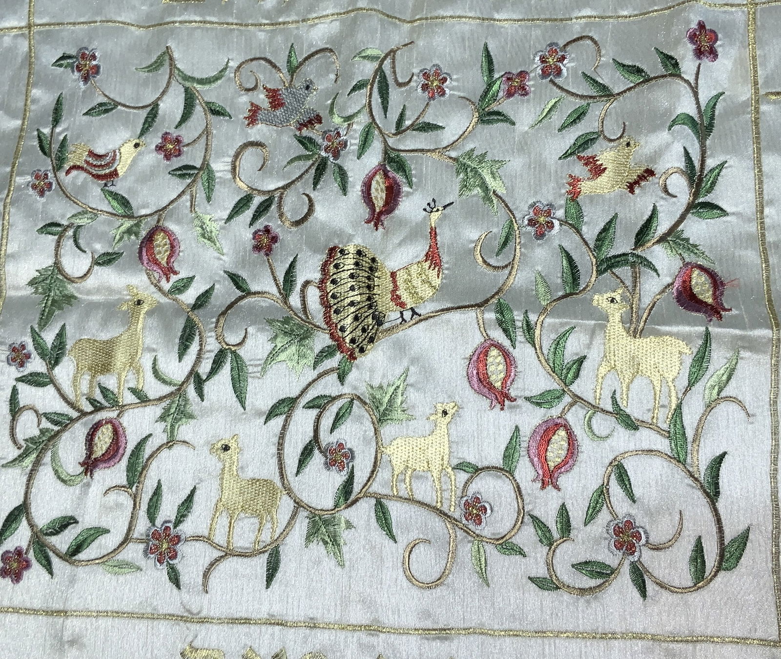 Yokarshi Embroidered Shabbat/ Table Tapestry: Embroidered Shabbat Challah Cover with Pomegranates, Birds and animals, Floral Pattern. Measures 21 x 18 in. Embroidered Hebrew. Possibly rayon/ polyester. challah bread cover, shabbat table decoratio