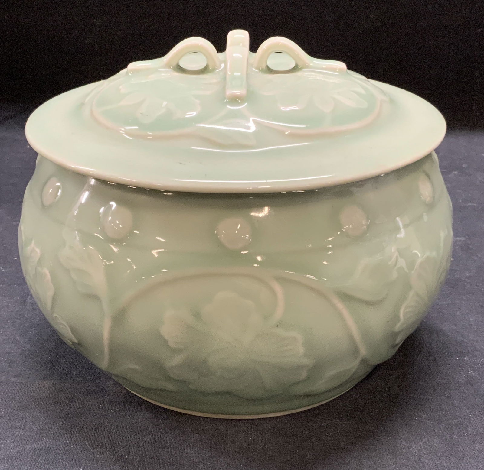 Antq Chinese Porcelain Celadon Lidded Bowl: Antique Chinese celadon glazed porcelain bowl with lid. Floral motif. Signed on underside. Some surface wear including scratches and crazing observed. Measures approx. 7 x 5.5 inches. Chinese bowl, Ch