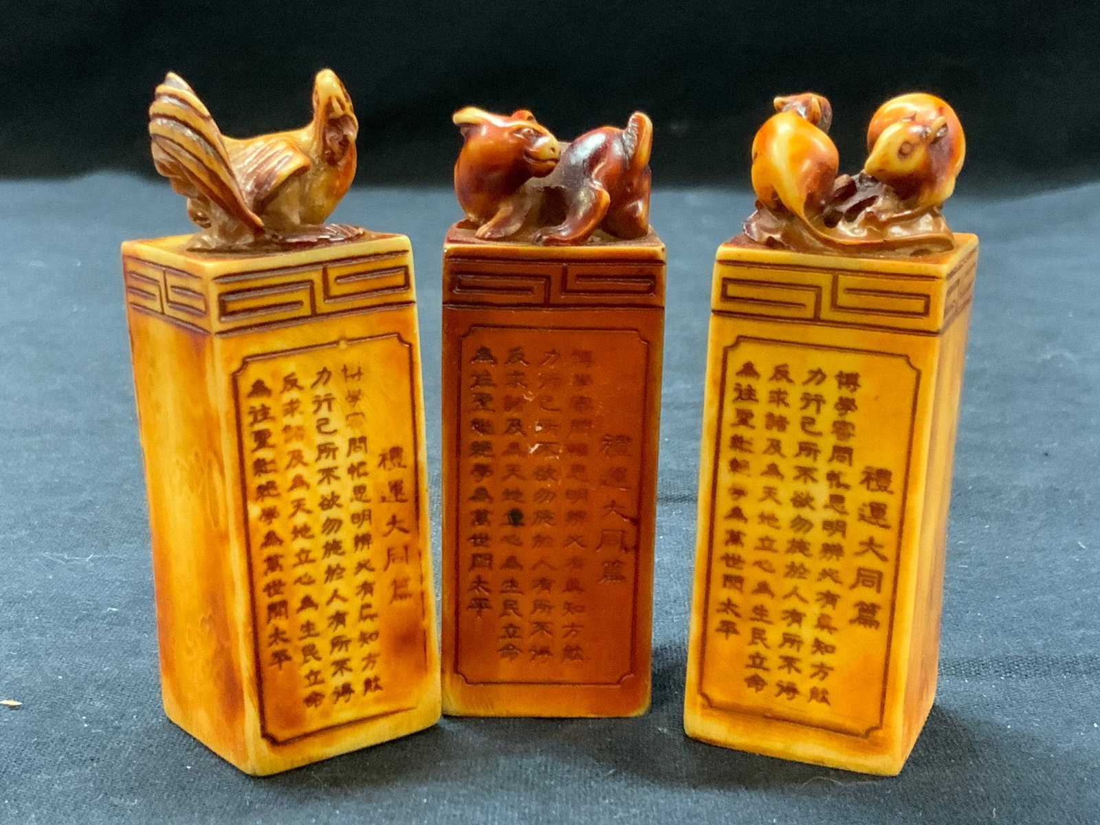3 Vintage Dyed Etched Asian Signature Blocks: Lot of 3 vintage Asian signature blocks with animals on tops, such as rabbit, chicken and rats, each post has Chinese character etched in the sides with no carvings in other bottoms. Approximately 3 i
