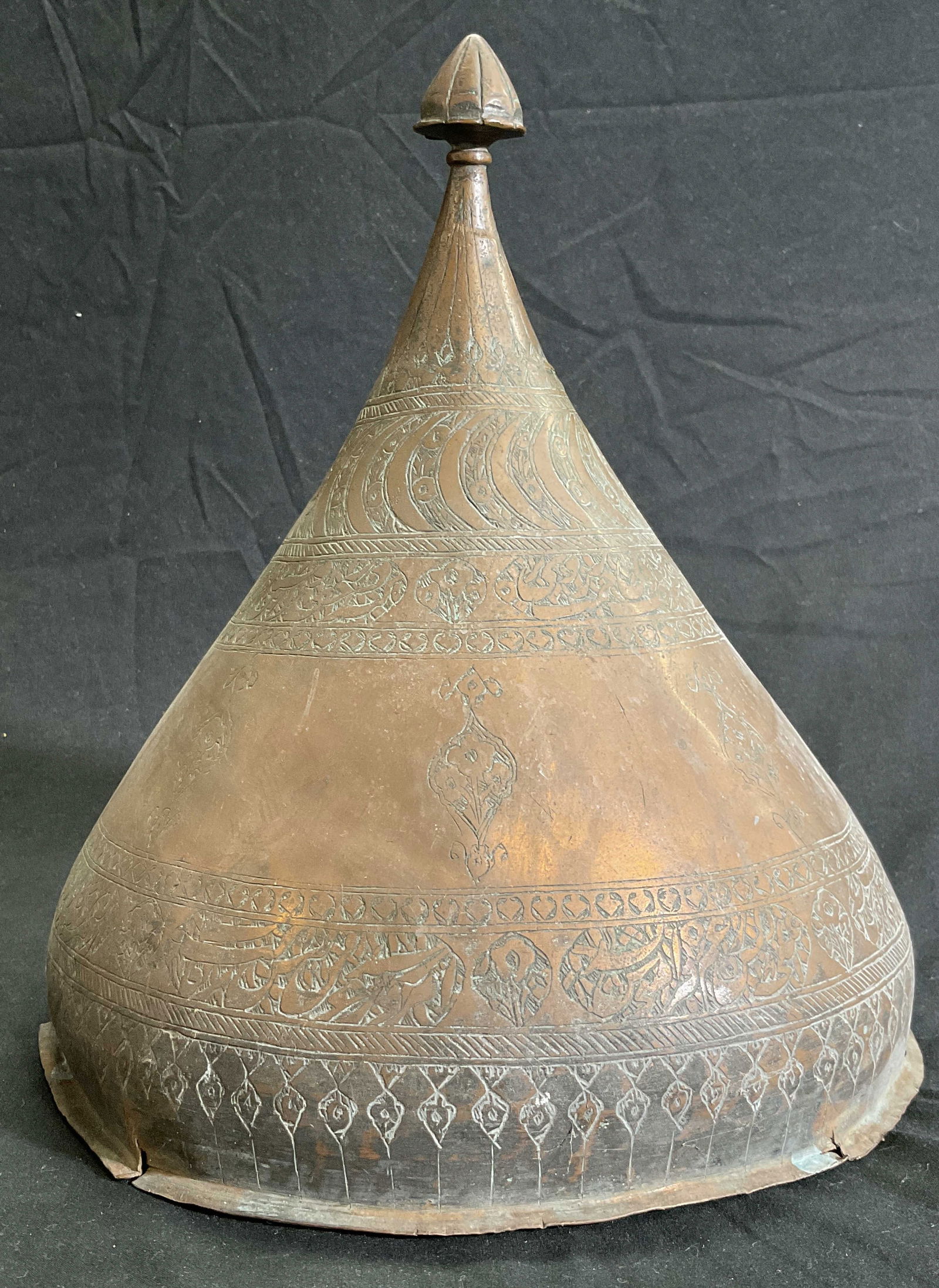 Vintage Hand Crafted Etched Metal Helmet: Vintage, possibly antique, hand crafted etched metal helmet. Piece appears to be copper, possibly copper plated. Designs feature florals, foliage, and repeating geometric patterns throughout. Topped w