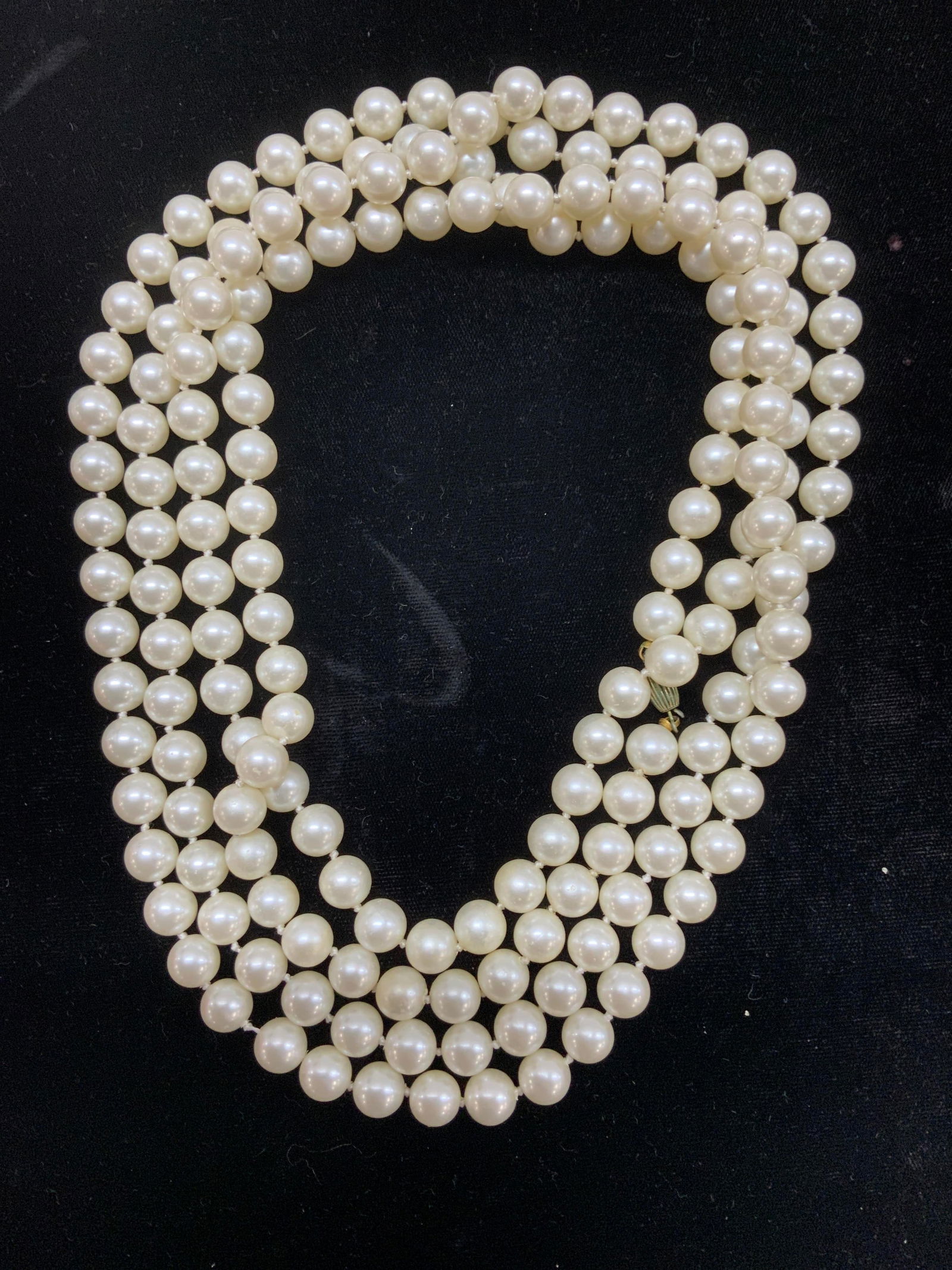 Pearlescent Rope Length Necklace: 37 in. Drop length of white costume Pearls, rope length necklace in the style of Chanel. Secure clasp, discoloration of clasp consistent with oxidation, unremarkable. Lightweight necklace.. Chunky jew