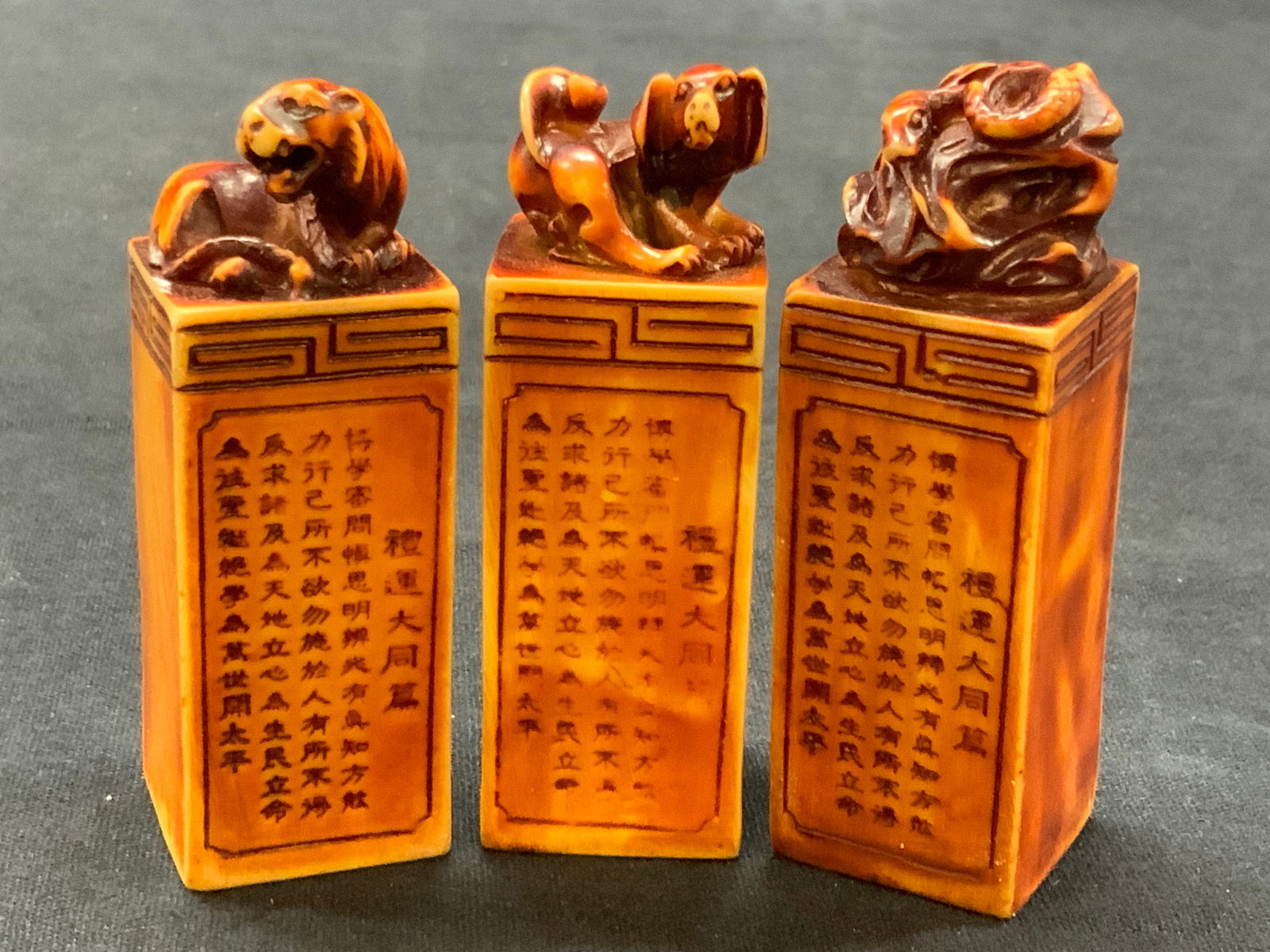 3 VNTG Asian Zodiac Animal Signature Blocks: Lot of 3 vintage Asian signature blocks with animals on tops, such as dog, tiger and snake , each post has Chinese character etched in the sides with no carvings in other bottoms. Approximately 3 inch