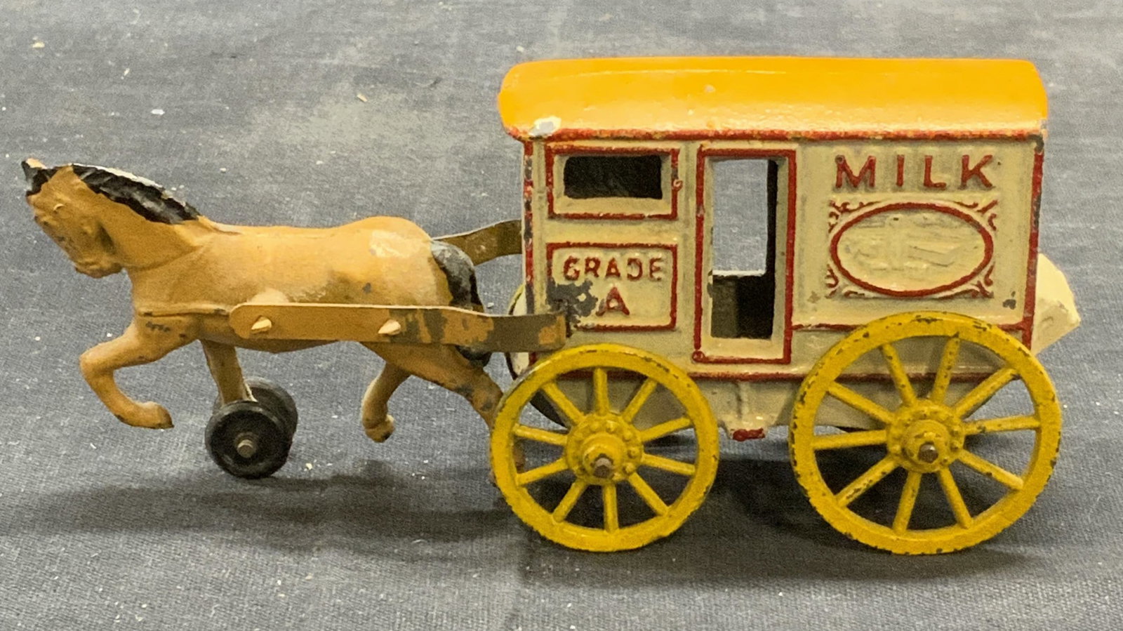 Vintage Cast Metal Horse Milk Cart Figural: Vintage, possibly antique, enameled cast metal horse pulled milk cart figural. Some loss to enamel. Measures approx. 5 x 1.25 x 2 inches. Property of Manhattan New York City Americana, Macys, & Milk B