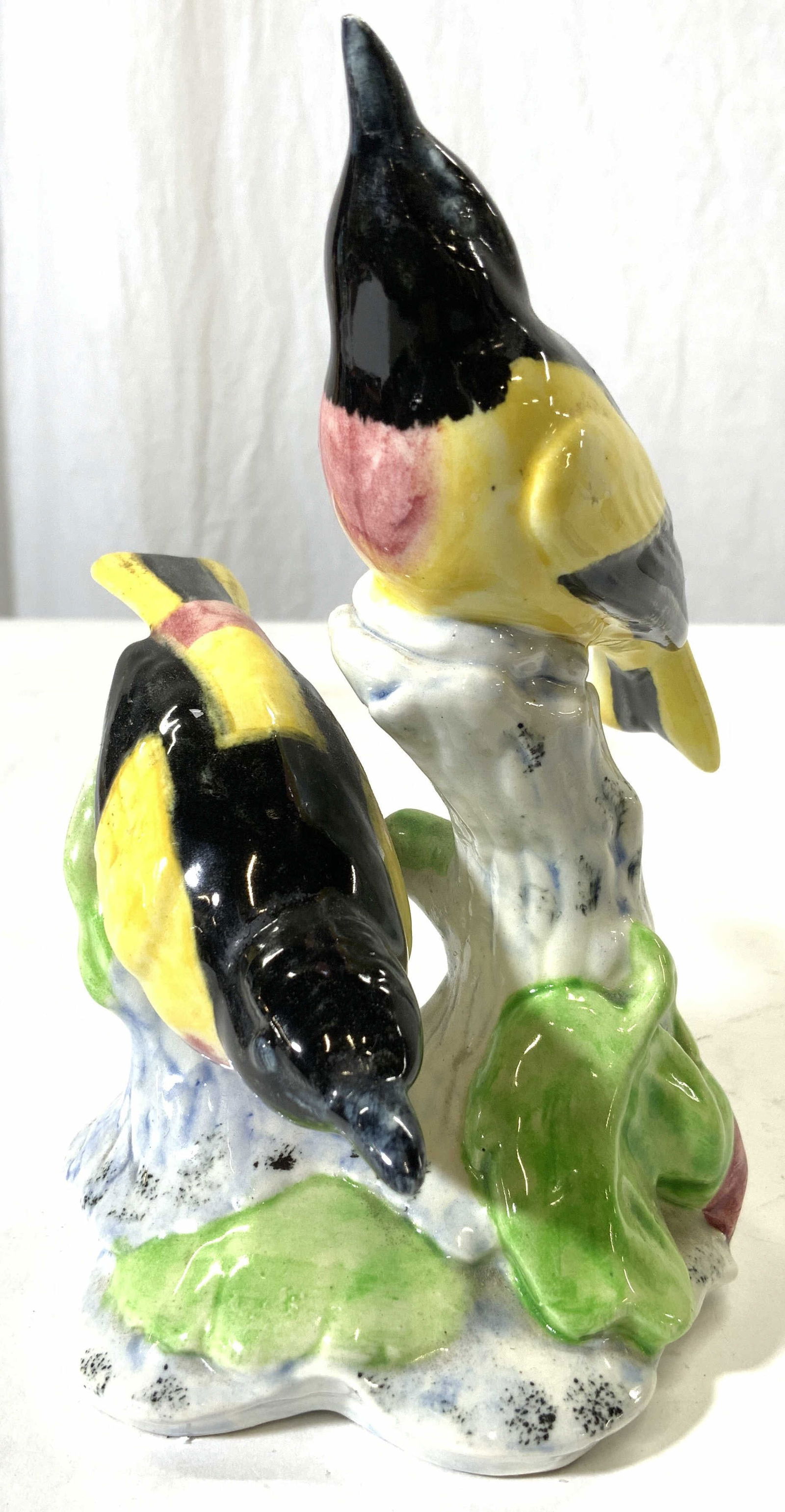 STANGL Porcelain Bird Figure Sculpture: Underside is marked STANGL 3402D DCF. Figure depicts 2 black and yellow birds perched on stumps. Piece is possibly hand painted. Measures approximately 6.25 inches tall 4 inches wide. Bird sculpture,