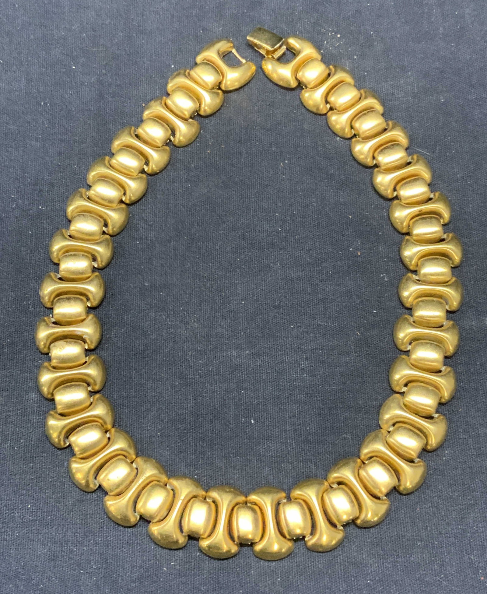 MONET Gold Tone Link Necklace: Monet gold tone link necklace. Signed on clasp. Total length approx. 16 inches long. Some surface wear including scratching consistent with exposure. Estate jewelry, costume jewelry, cocktail jewelry,