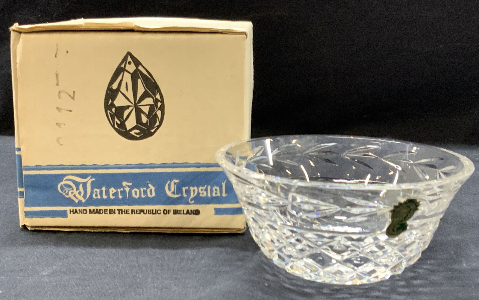 Vintage Hand Made Waterford Crystal Bowl W Box: Vintage cut crystal Waterford bowl. Marked on underside Waterford, approximately 2.25 inches tall and 5 inch diameter. Comes with off white blue banded box that reads Waterford Crystal, hand made in t