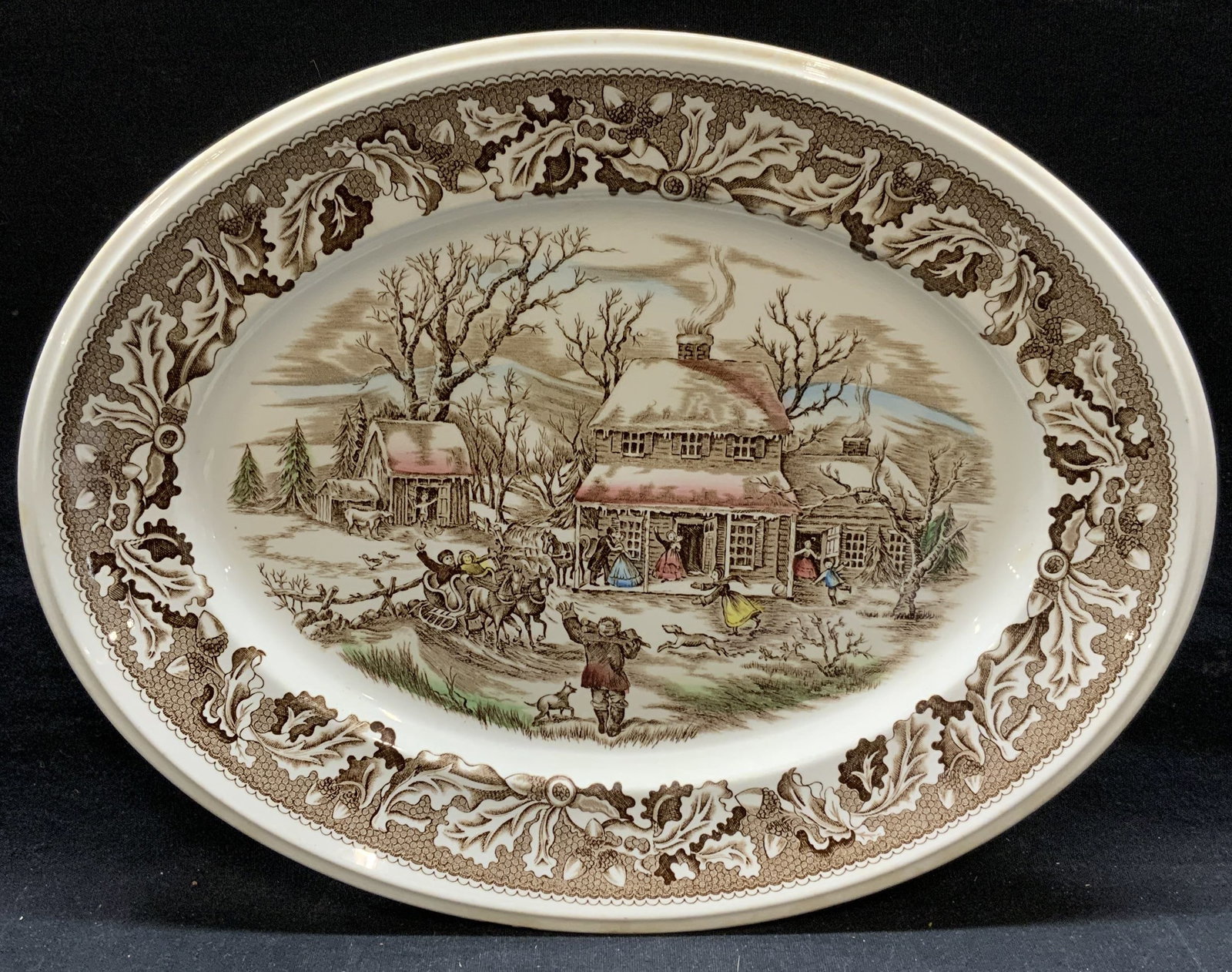 Johnson Bros Homecoming Ironstone Platter: Johnson Bros Neighbors Homecoming pattern ironstone platter. Trademarked to underside. Made in England. Some surface wear including crazing observed. Measures approx. 12.25 x 9.5 inches. Johnson bros,