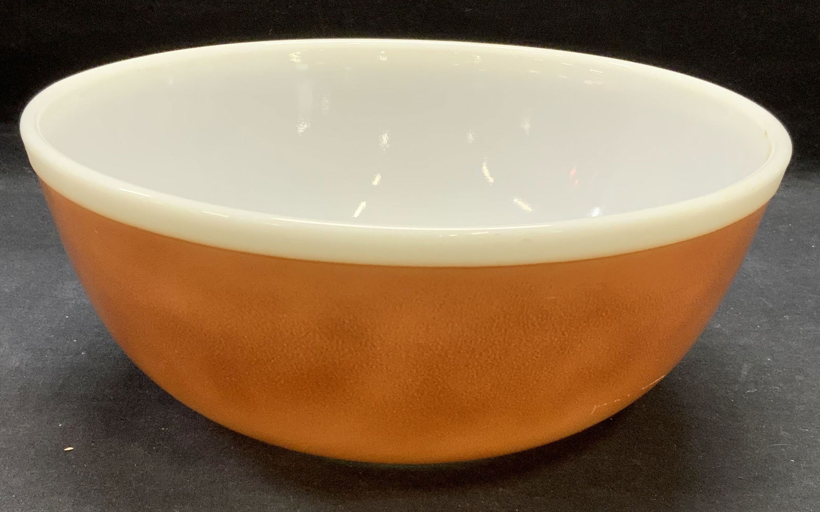 Pyrex Brown Glass Mixing Bowl: Pyrex brown glass mixing bowl. Trademarked to underside. Some surface wear including scratching observed. Measures approx. 10.5 x 4.25 inches. Pyrex, Pyrex bowl, Pyrex mixing bowl, glass bowl, mixing