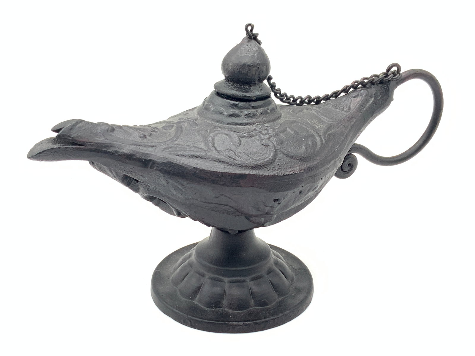 Vintage Cast Iron Genie Lamp Incenser: Vintage black cast iron made genie lamp censer with looped handle and chain connecting the top to the handle. Approximately 6 inches tall and 9.25 inches long. Moderate wearing to interior and wearing