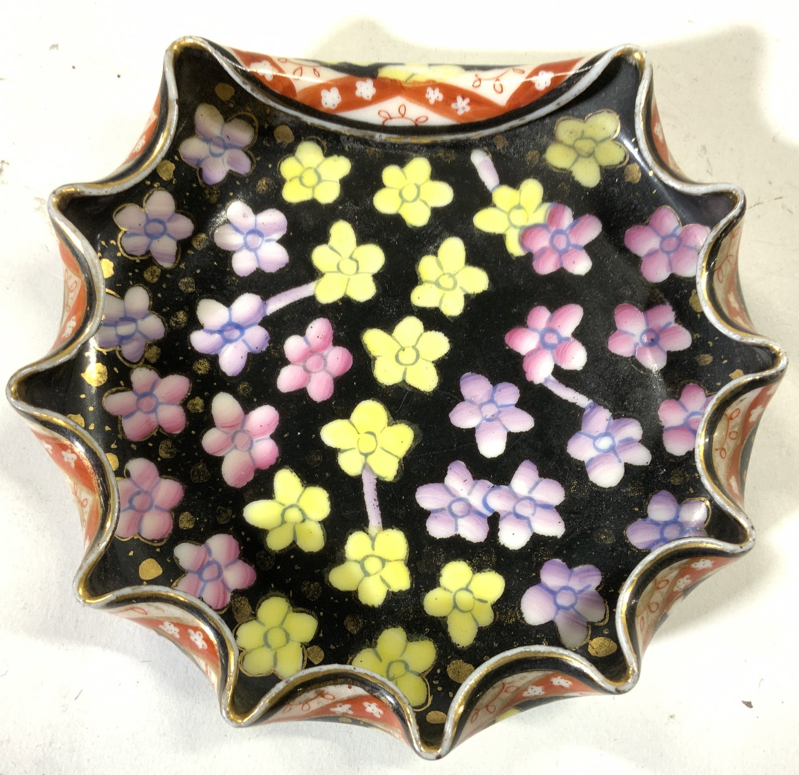 ROYAL VIENNA Vtg Handkerchief Porc Trinket Dish: Underside has ROYAL VIENNA and inscribed number 10. Beehive trademark. Piece is vintage and porcelain. Trinket Dish has handkerchief style structure with folds in rim. Piece is hand painted black with