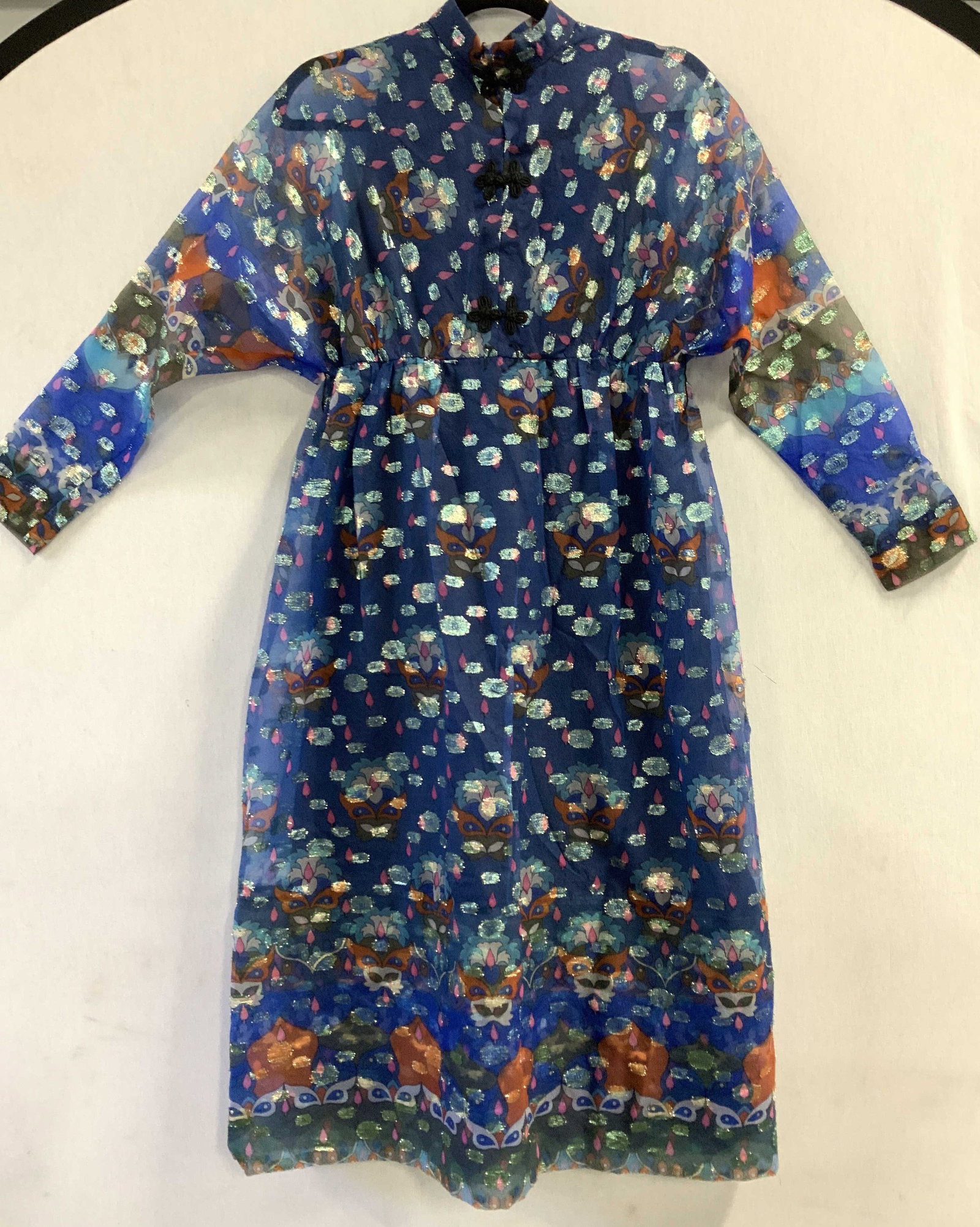 Lee Jordan NY Asian CocktailDress: Vintage Asian cocktail dress with high collar, Asian buttons, multiple Asian patterns , semi sheer sleeves. First 2 buttons can be undone for a peep hole. Blue with metallic accents over pattern. Line