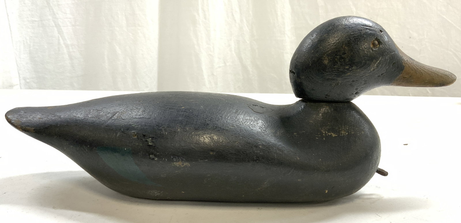 Vntg Carved Wooden Duck Decoy Figure: Duck decoy figure is black toned and wooden. Piece Is vintage possibly antique. Appears to be hand crafted. Piece measures approximately 15.5 inches long 6.5 inches tall 5.25 inches wide. Duck decoy, 