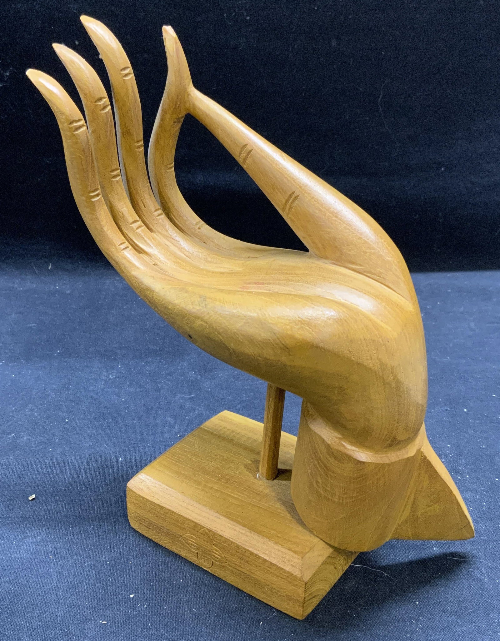 Vitarka Mudra Carved Wood Hand Sculpture: Hand carved wooden sculpture on base depicts Vitarka Mudra Buddhist hand position. Some surface wear including small chip to finger observed. Possibly Cambodia or Thailand origin. Measures approx. 7 x