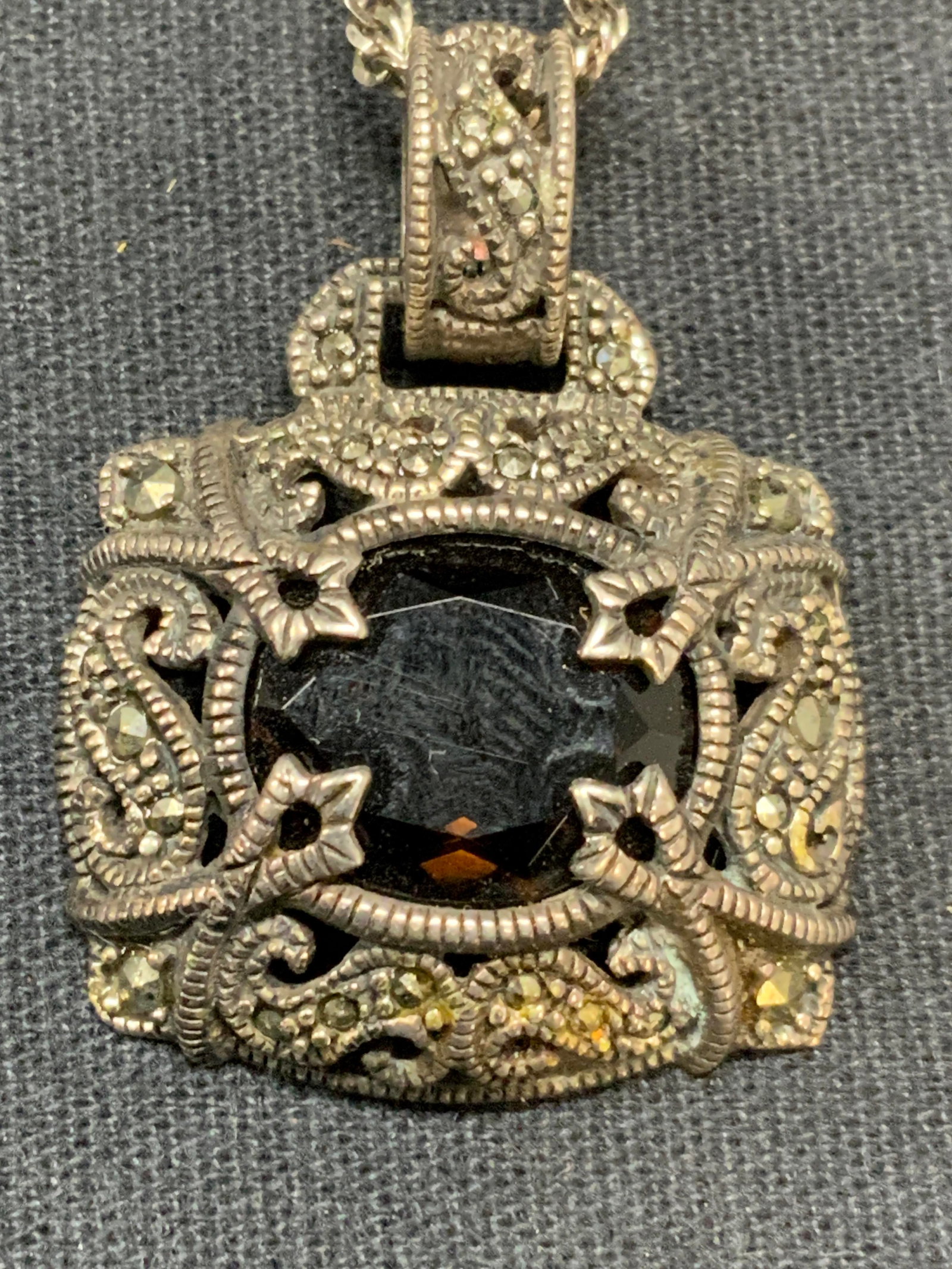 Sterling Silver Black Spinel Pendant Necklace: Vintage sterling silver necklace with sterling silver, marcasite and black spinel pendant. Necklace marked 925 A Italy on clasp. Pendant marked 925 Thailand to underside. Drop length approx. 11.5 inch