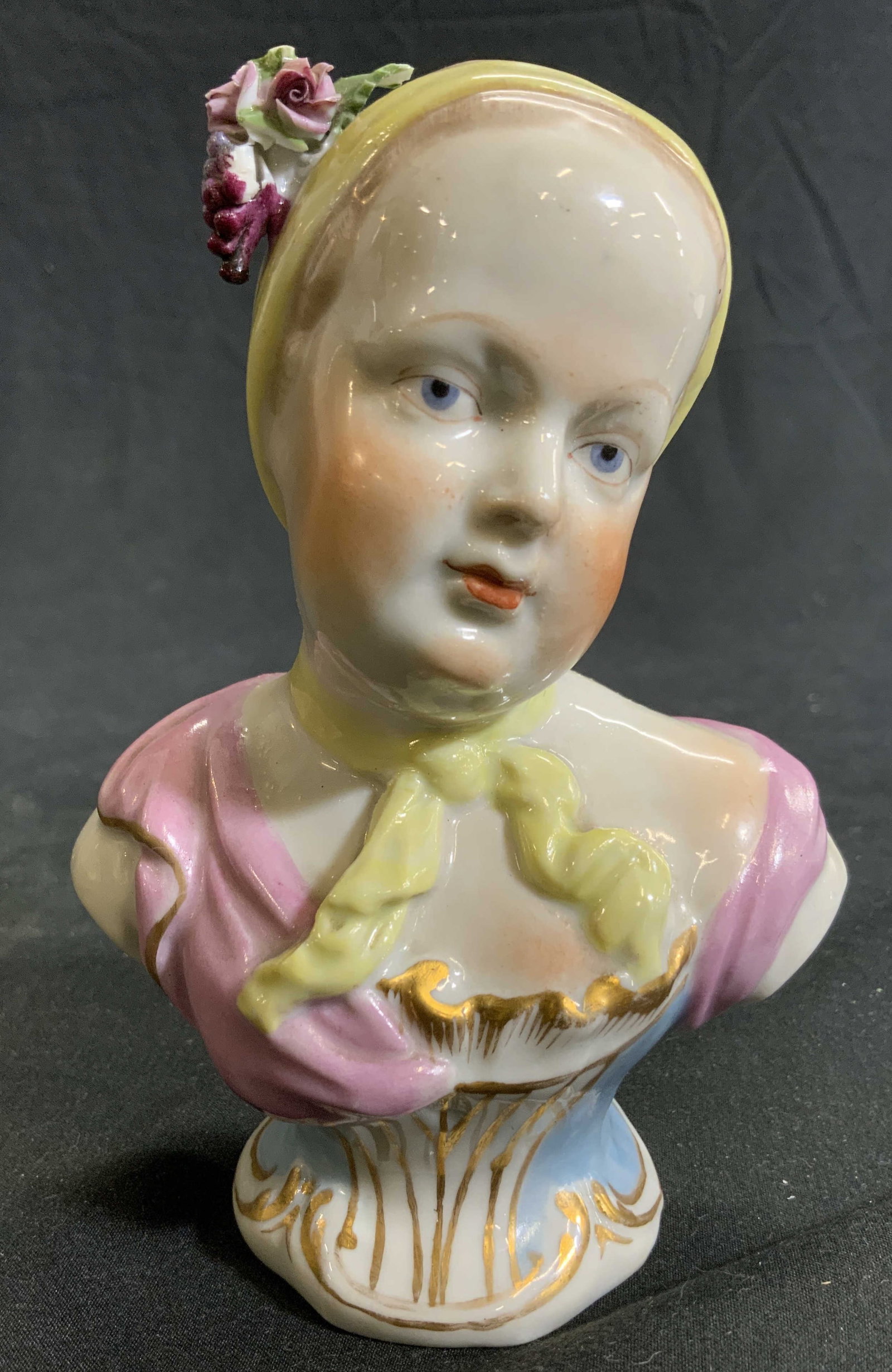 MEISSEN Antique Porcelain Bust Of Female Figure: Backside has MESSIEN Trademark. Piece is vintage appears to be antique. Bust is porcelain, depicts a female figure wearing hat with flowers & leaves. Piece has gilt detailed areas. Some elements appea
