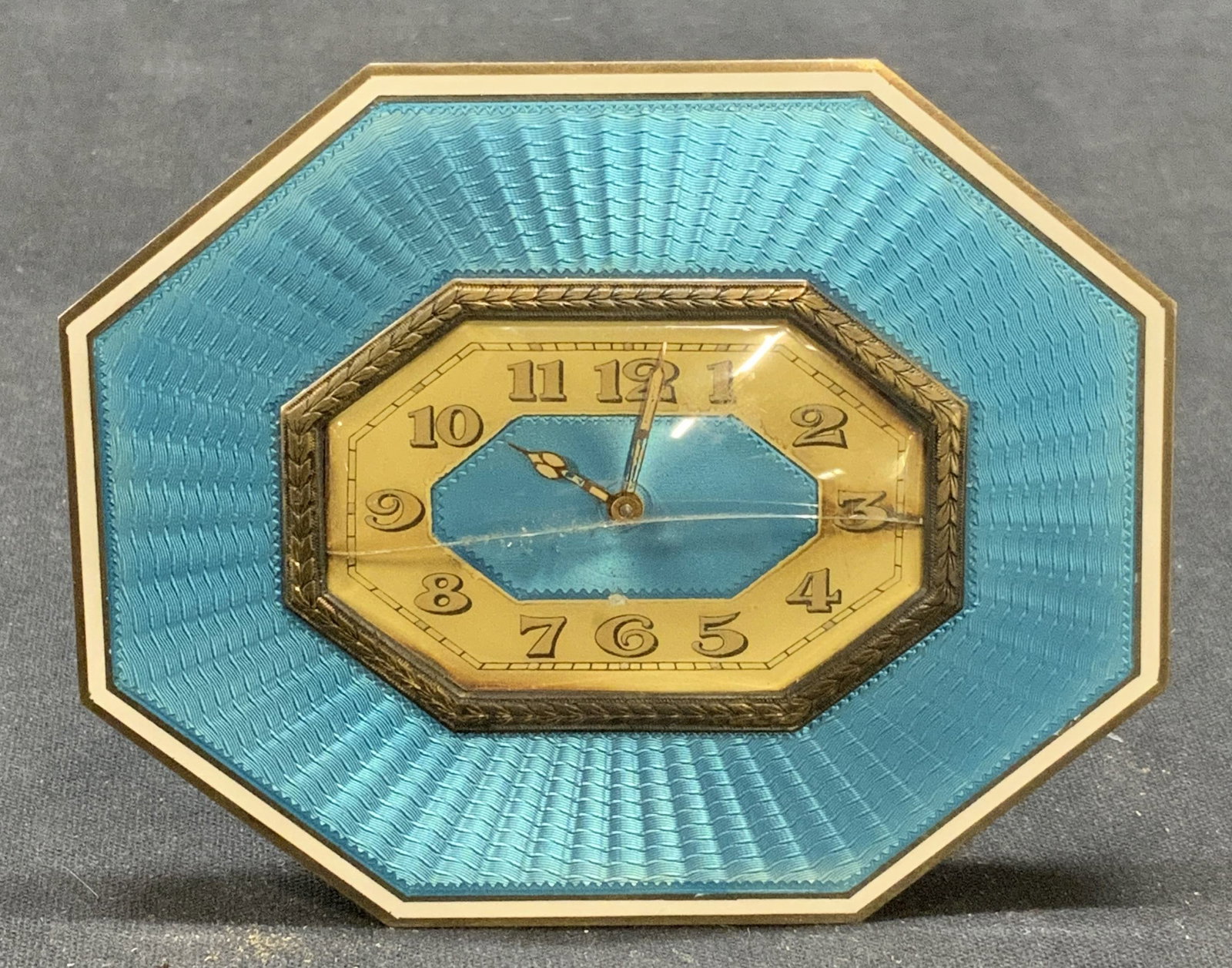 Antq Argent Dore Sterling Silver Guilloche Clock: Antique JC Argent Dore sterling silver clock with blue guilloche decoration. Sterling silver, glass, and metal. Crack on glass to clock face. Not tested for function. Surface wear consistent with expo