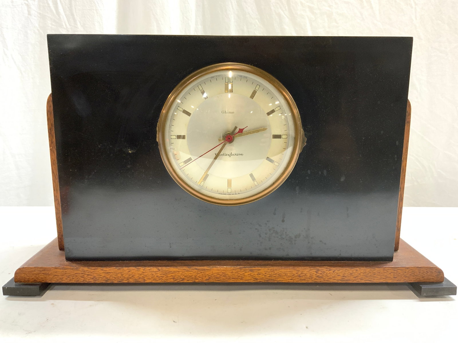 WESTINGHOUSE Wood & Veneer Vtg Mantel Clock USA: Clock face reads WESTINGHOUSE MADE IN USA. Clock is black and brown toned. Piece has openable window. Appears to be wood & veneer. Clock measures approx 18.75 inches long 10.5 inches tall 7 inches dee